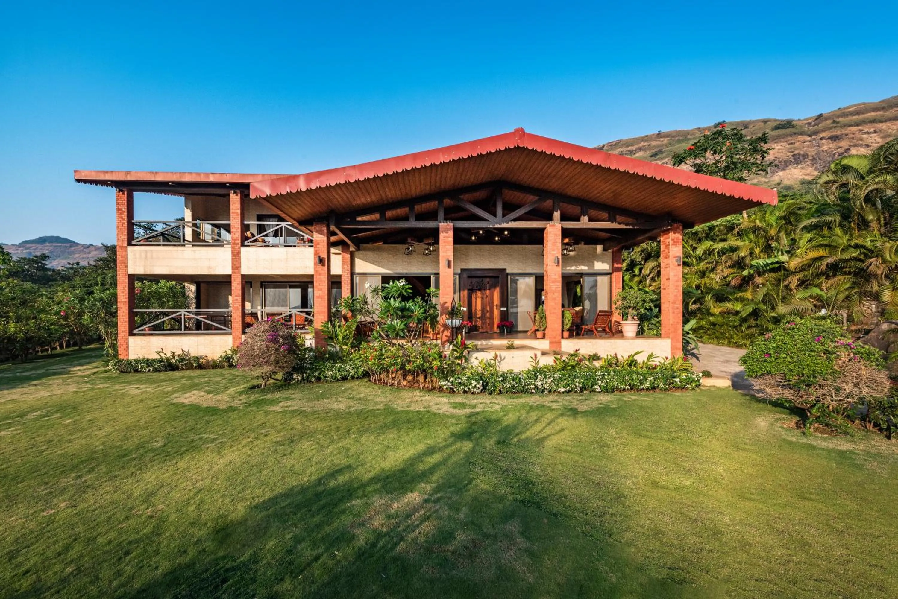 Property building in SaffronStays Althea - 4BR veg-only luxury villa with pool, jacuzzis, gourmet meals and Lohagad-Pawna lake views