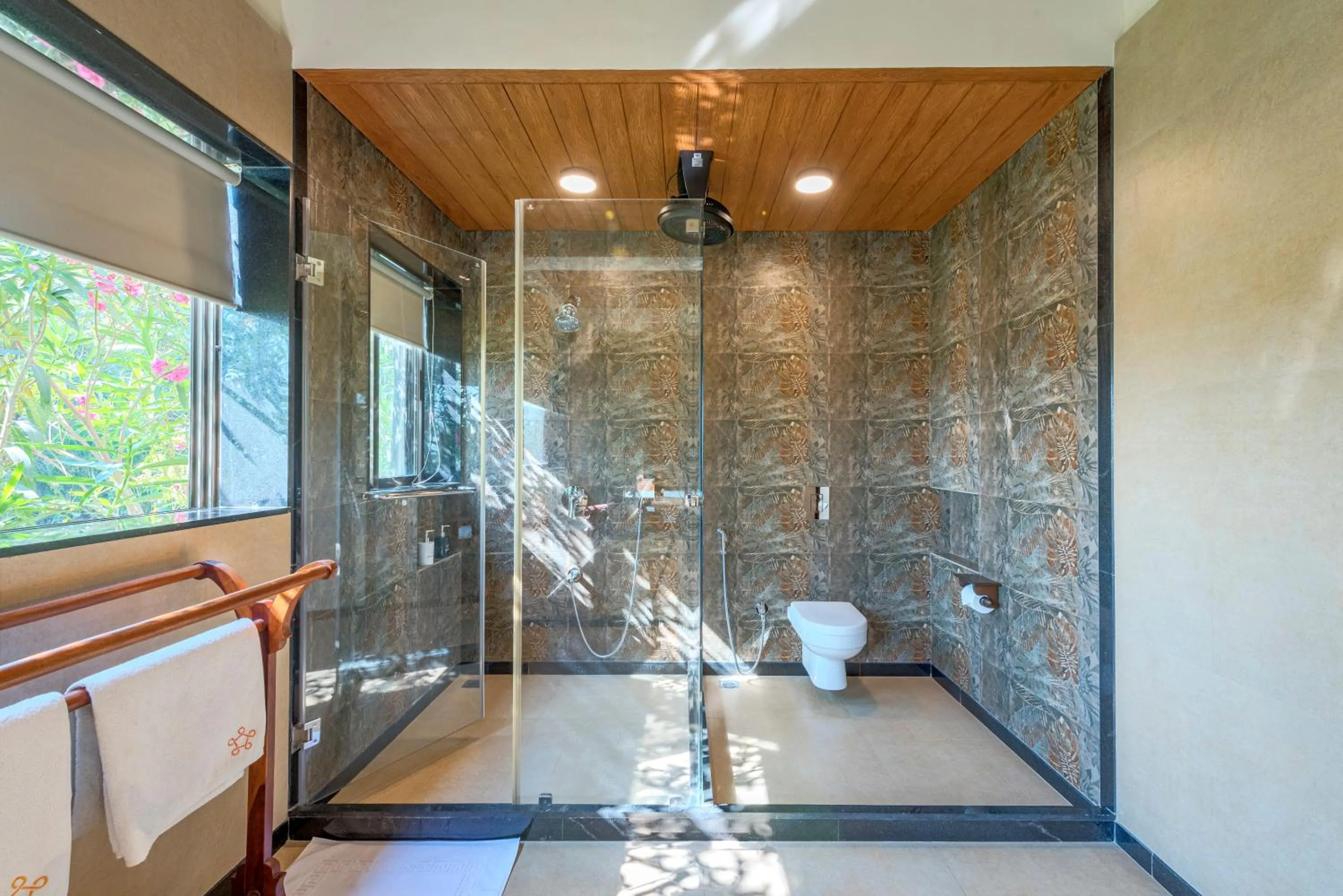 Shower in SaffronStays Althea - 4BR veg-only luxury villa with pool, jacuzzis, gourmet meals and Lohagad-Pawna lake views