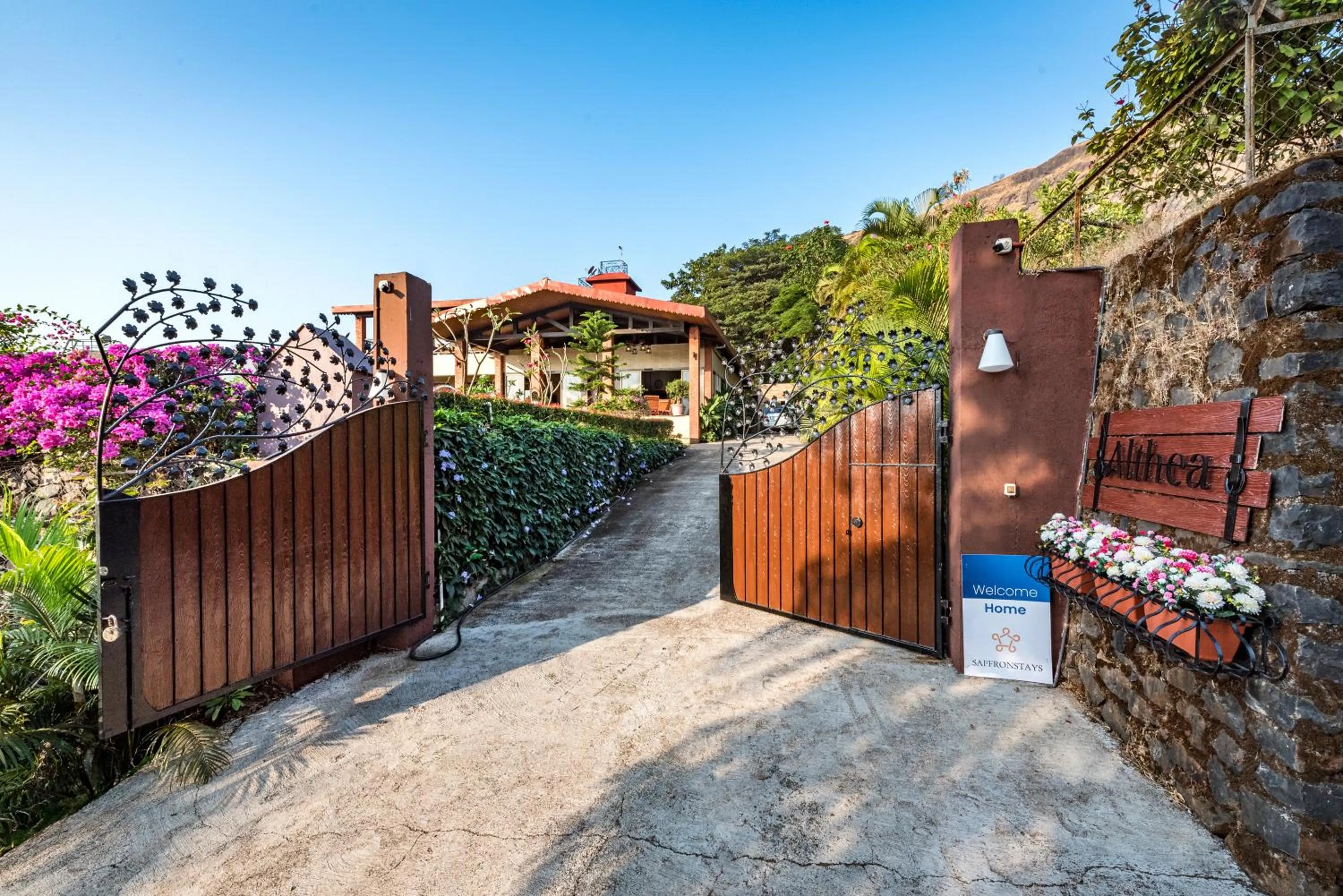 Property building in SaffronStays Althea - 4BR veg-only luxury villa with pool, jacuzzis, gourmet meals and Lohagad-Pawna lake views