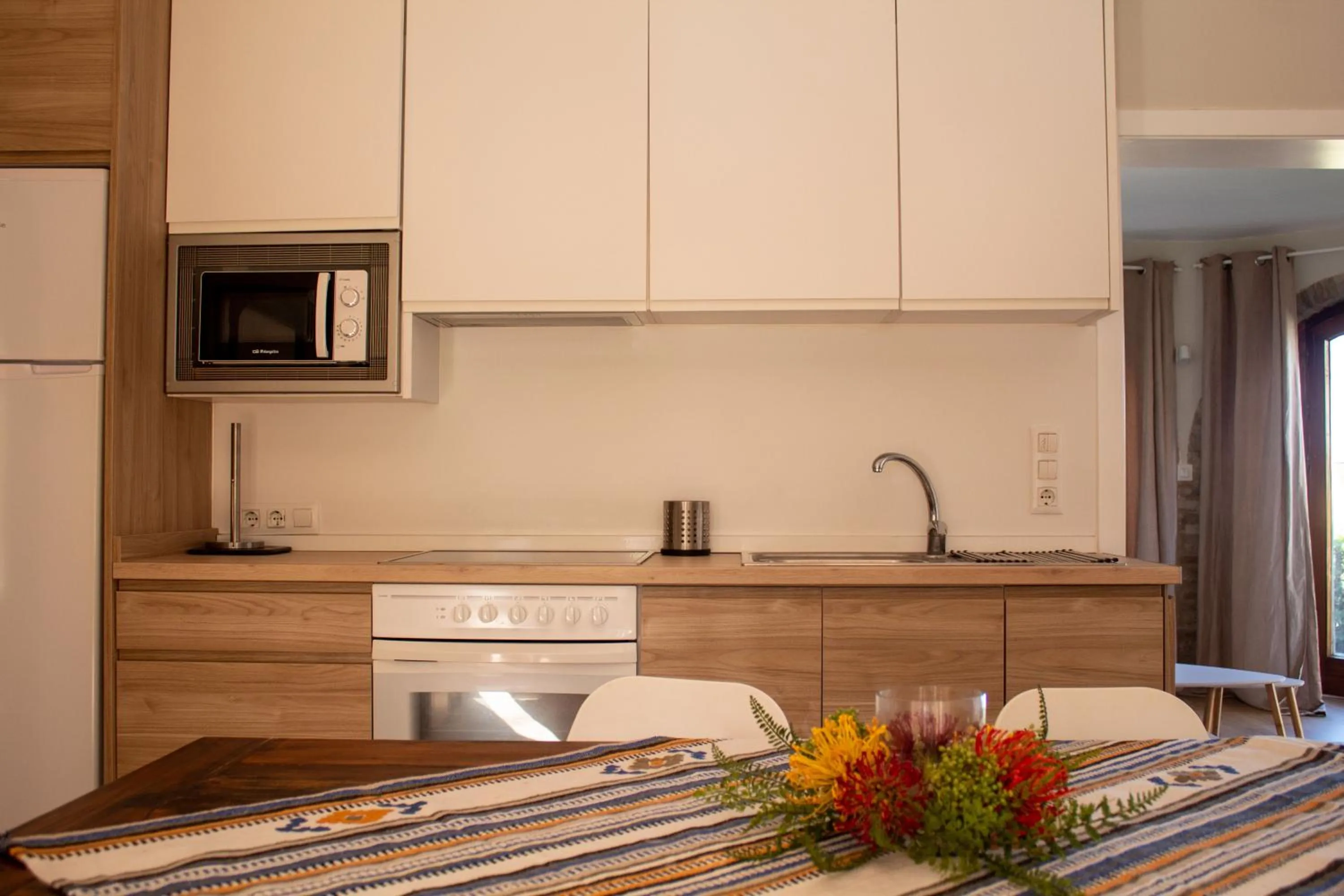 Kitchen or kitchenette in MR Hotelet de la Raconà & Apartments