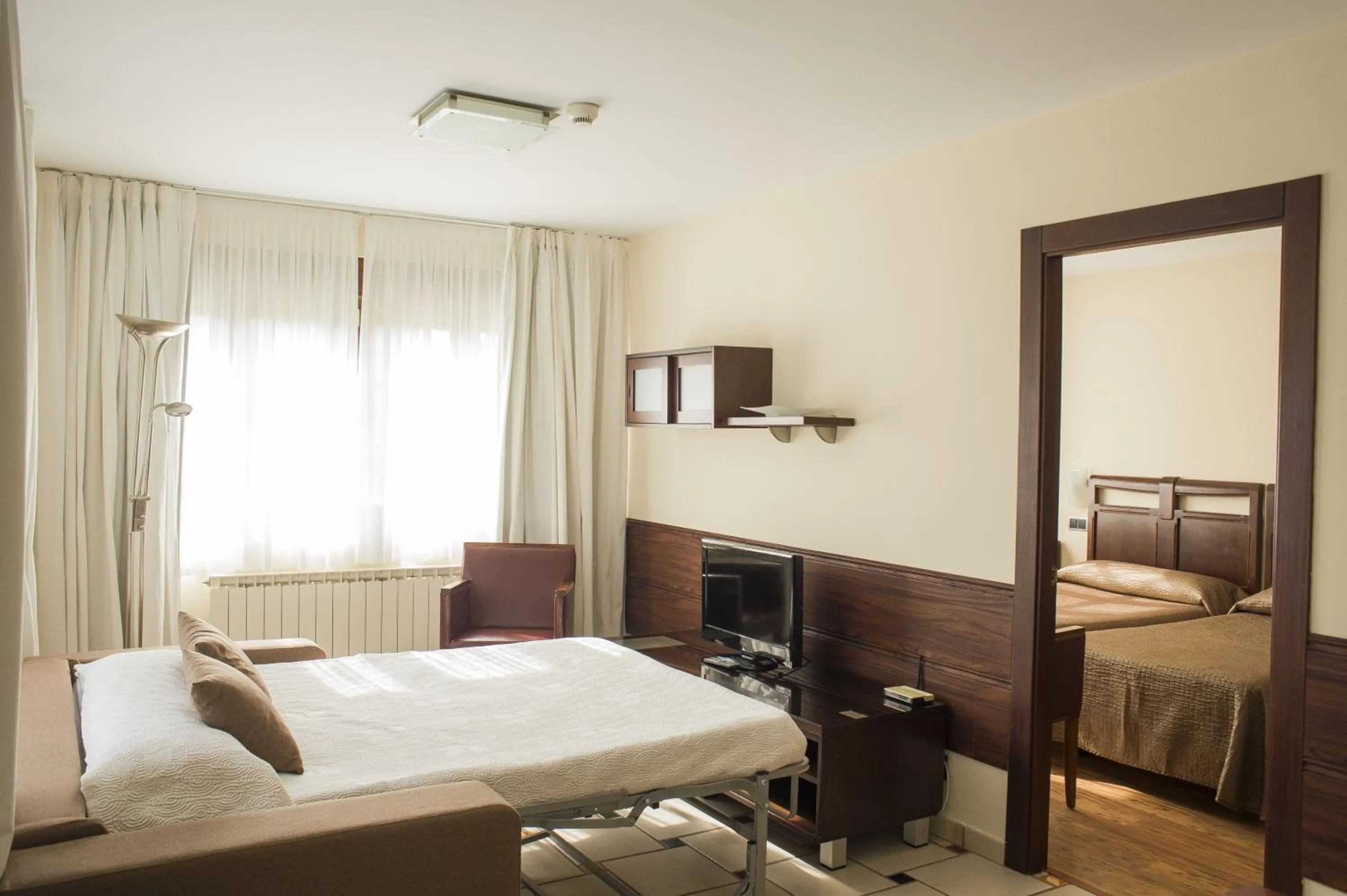 Living room, Bed in Apartamentos Costa Esmeralda