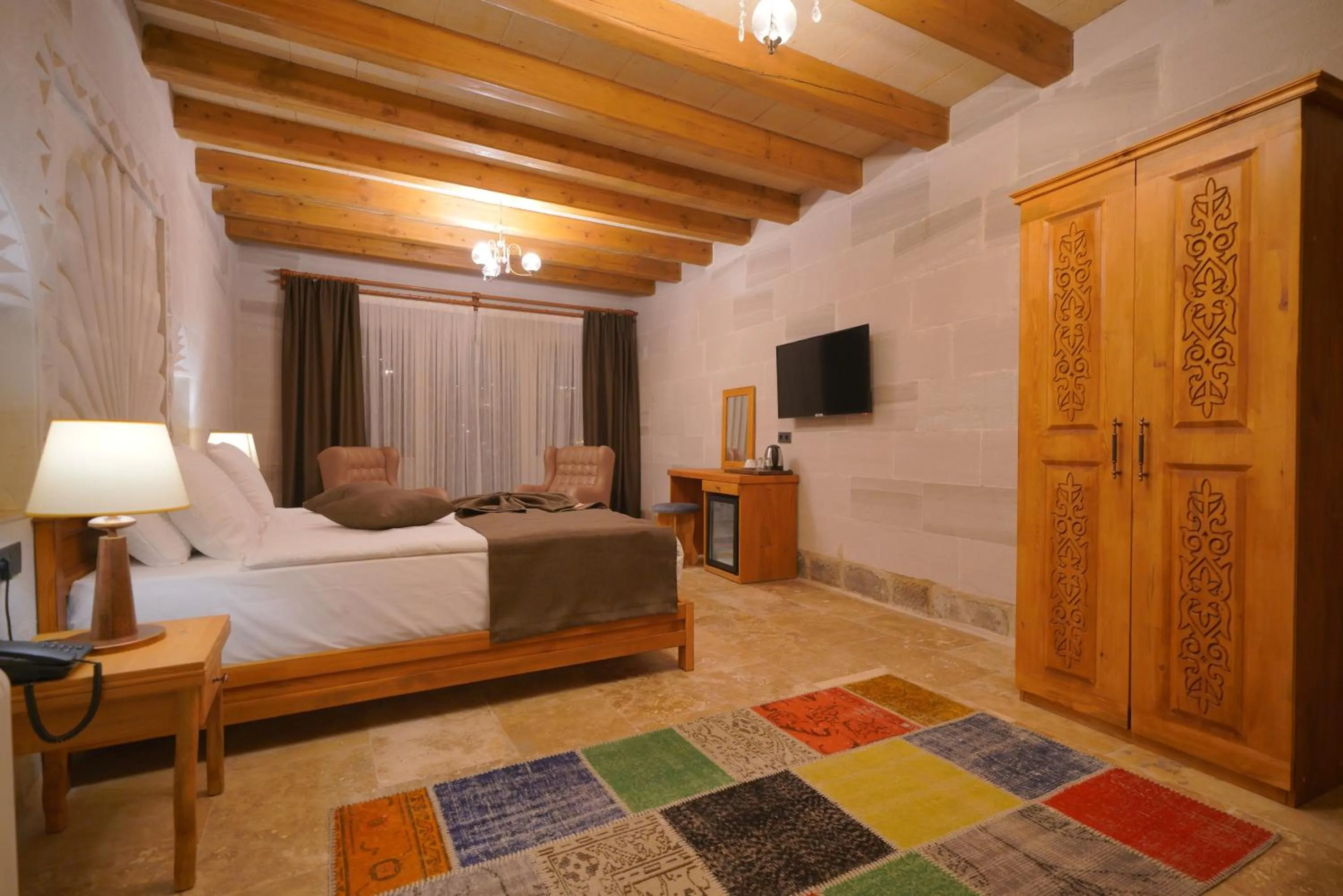 Communal lounge/ TV room, Bed in Cappadocia Secret Hill Cave Suites