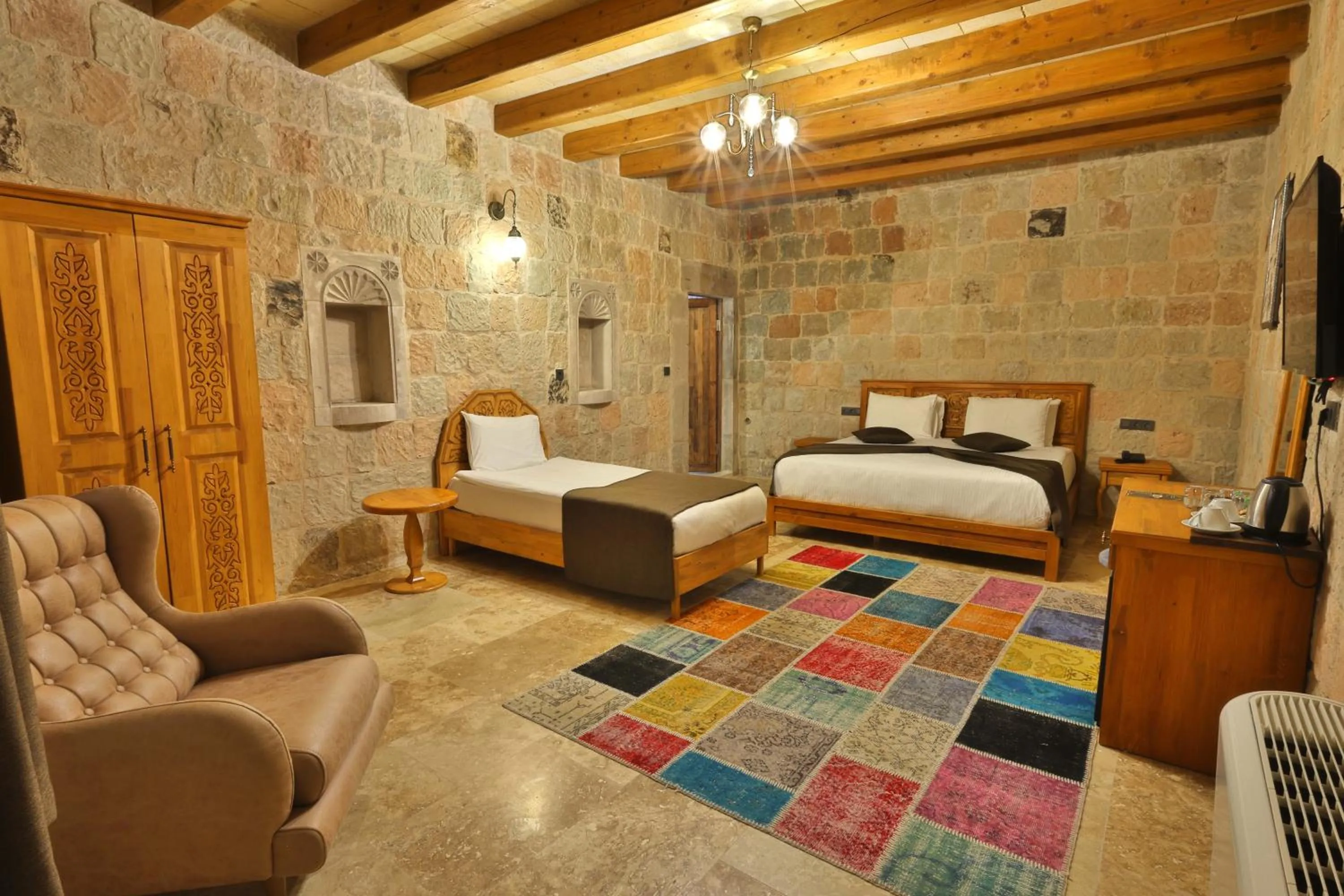 Communal lounge/ TV room, Bed in Cappadocia Secret Hill Cave Suites