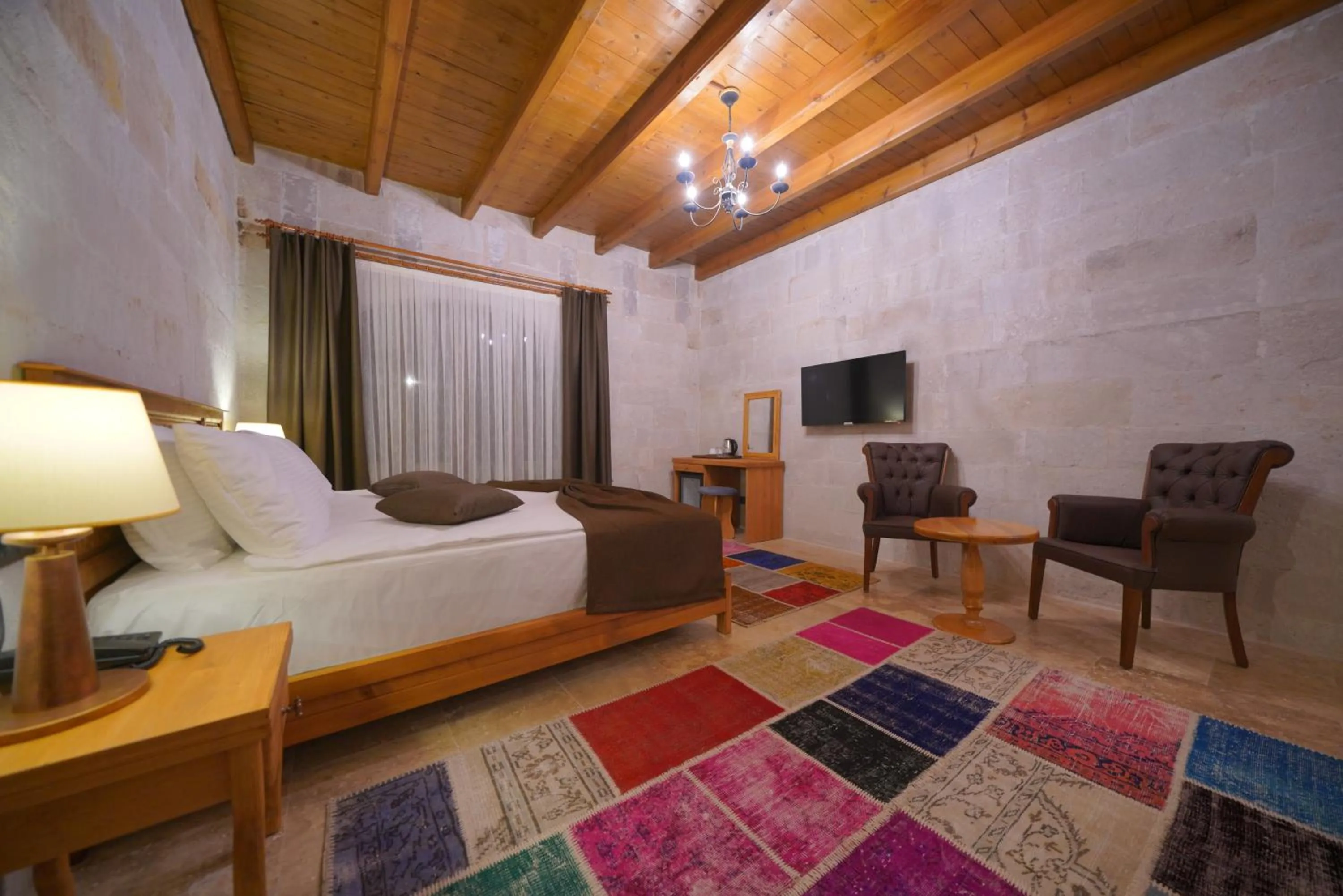 Communal lounge/ TV room, Bed in Cappadocia Secret Hill Cave Suites