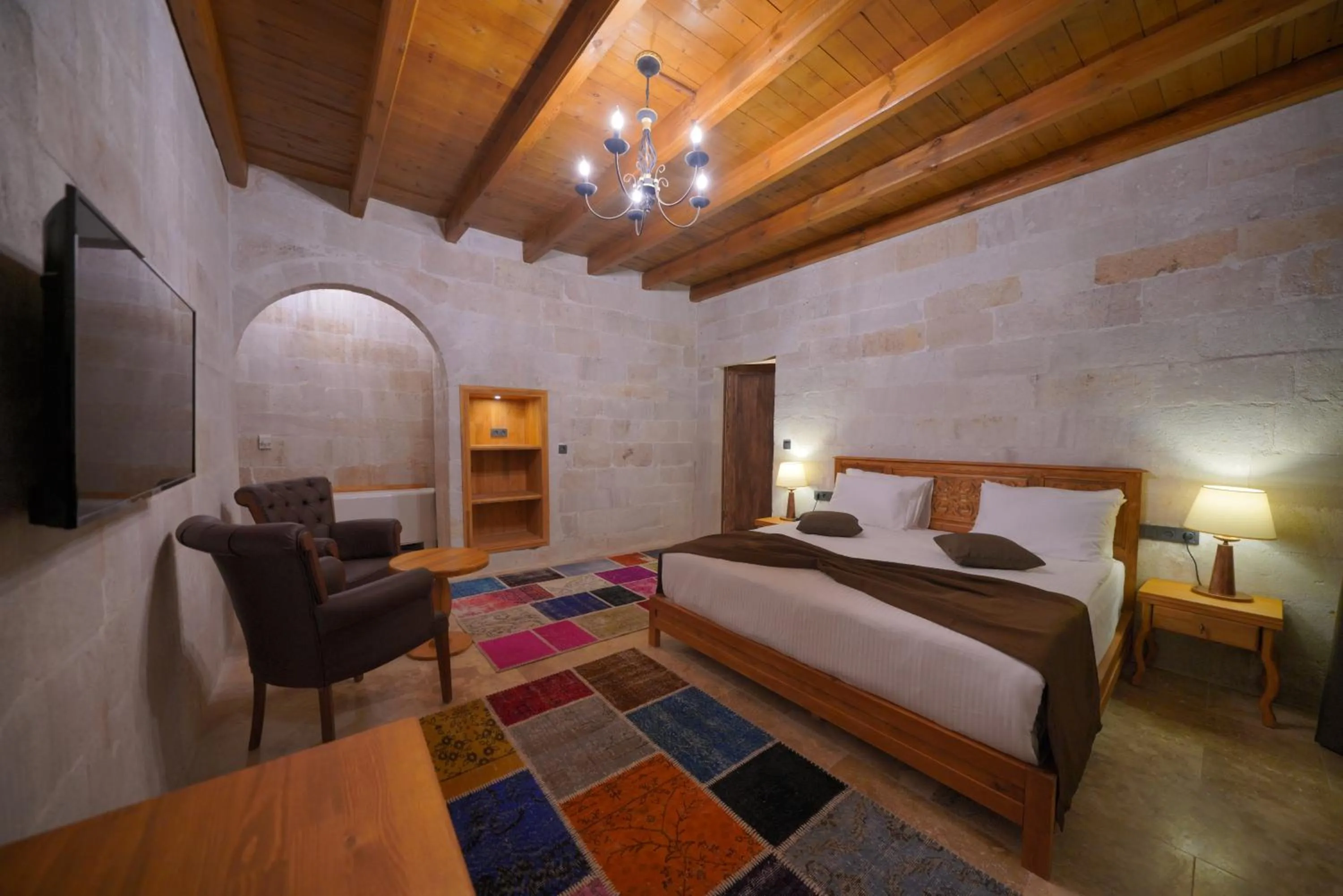Communal lounge/ TV room, Bed in Cappadocia Secret Hill Cave Suites