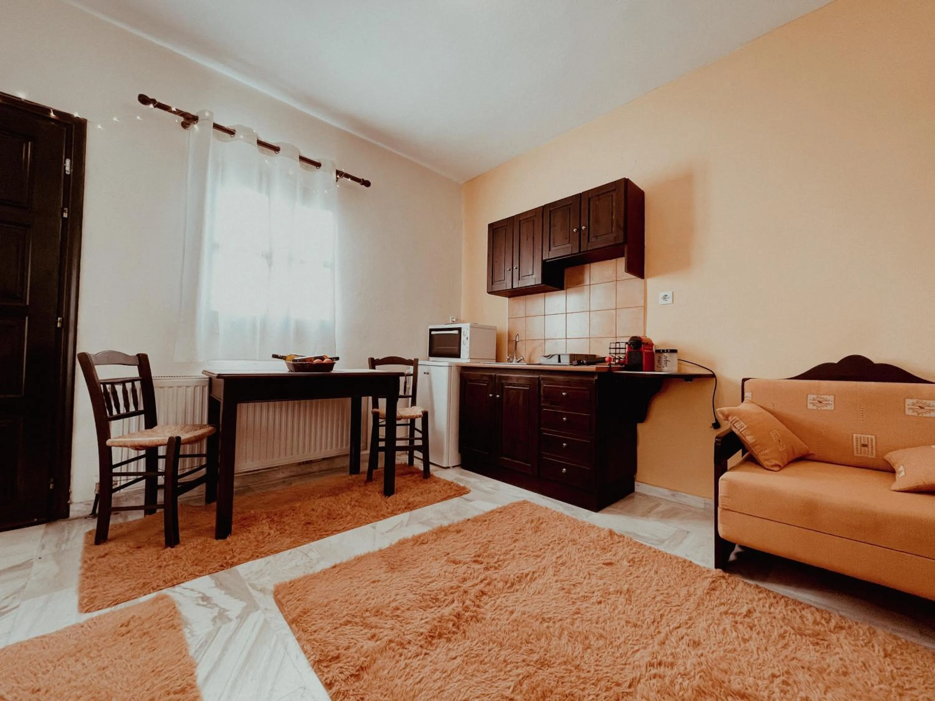 Kitchen or kitchenette in Muses Apartments