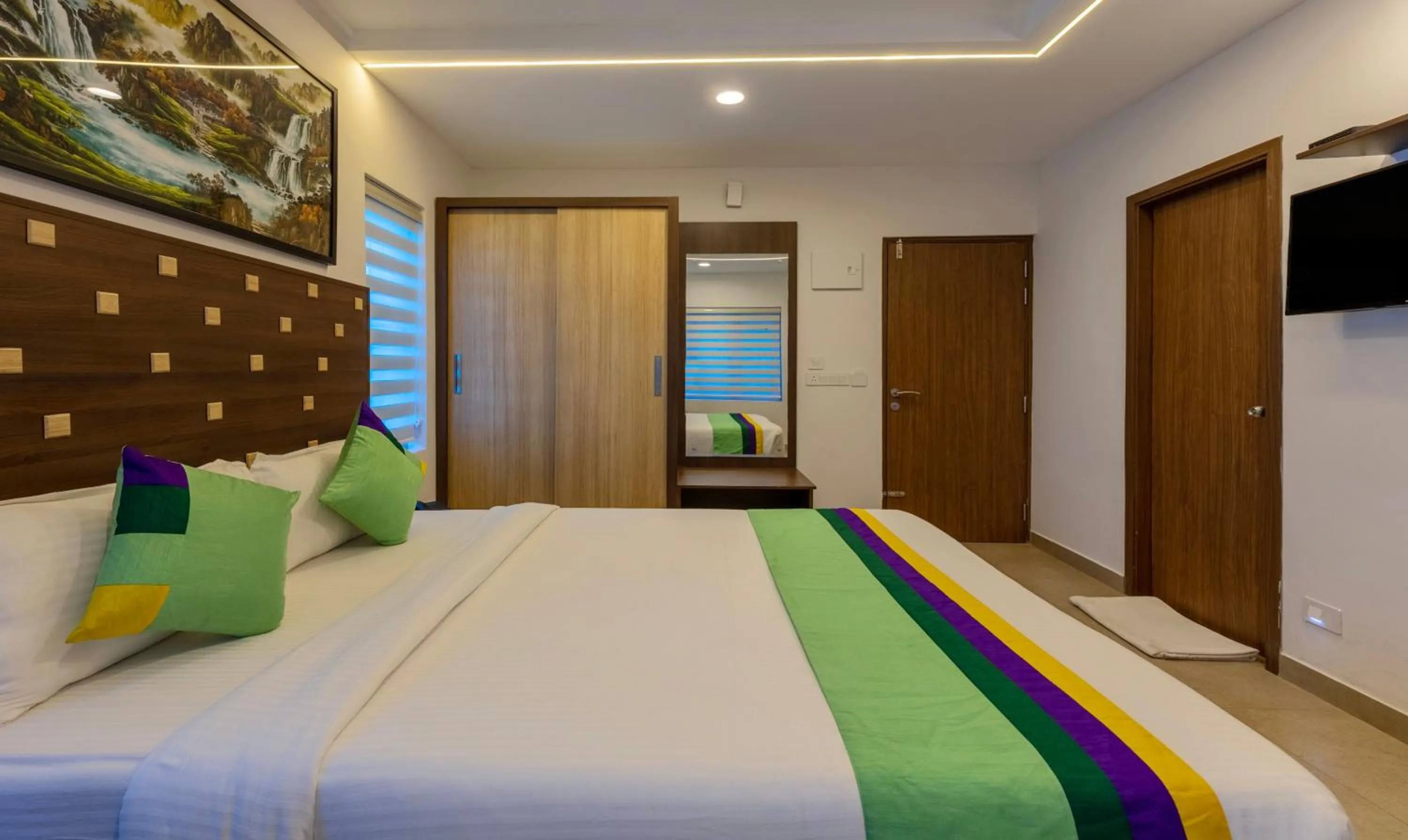 Bed in Treebo vSaffron Regency, Punnamada Lake