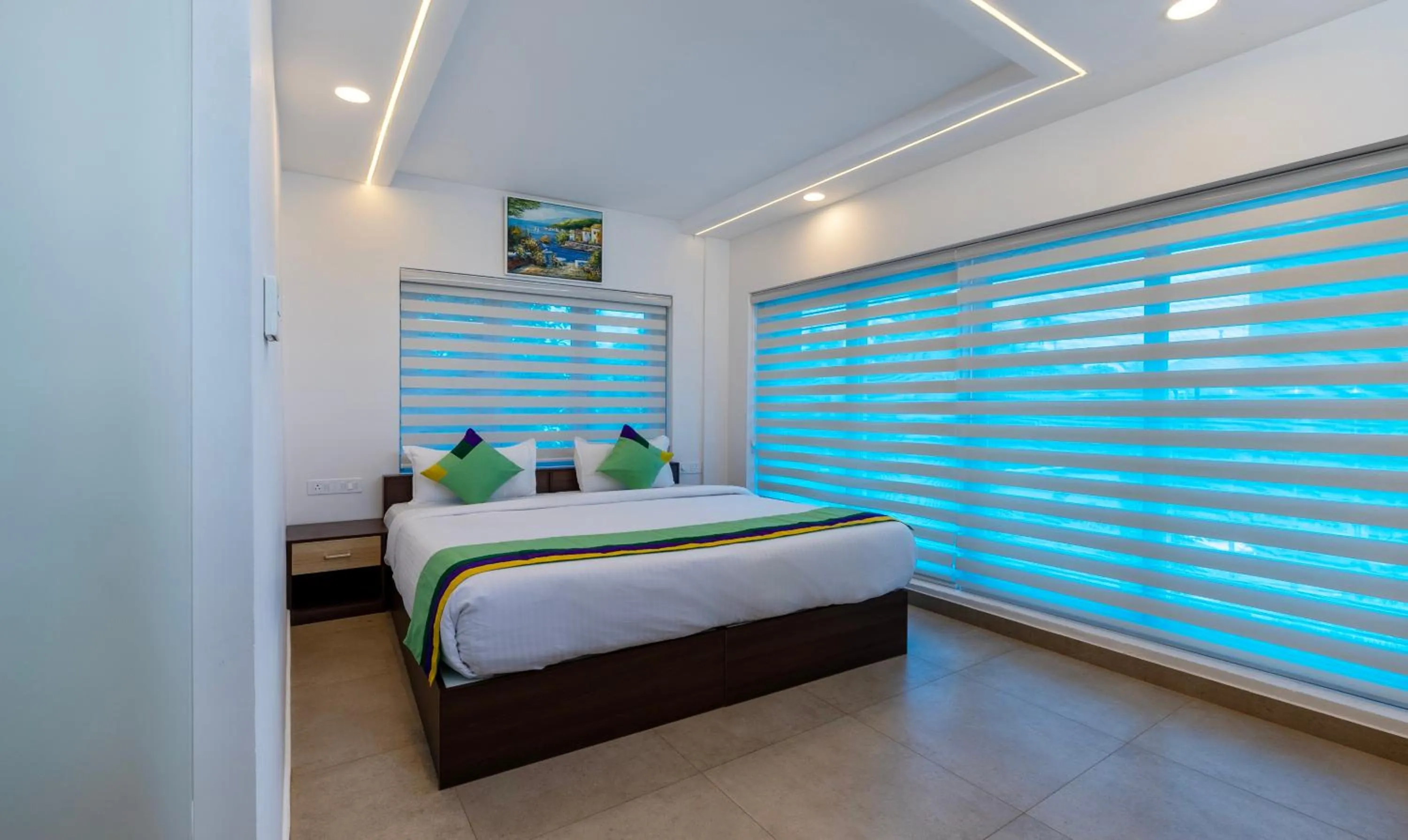 Bed in Treebo vSaffron Regency, Punnamada Lake