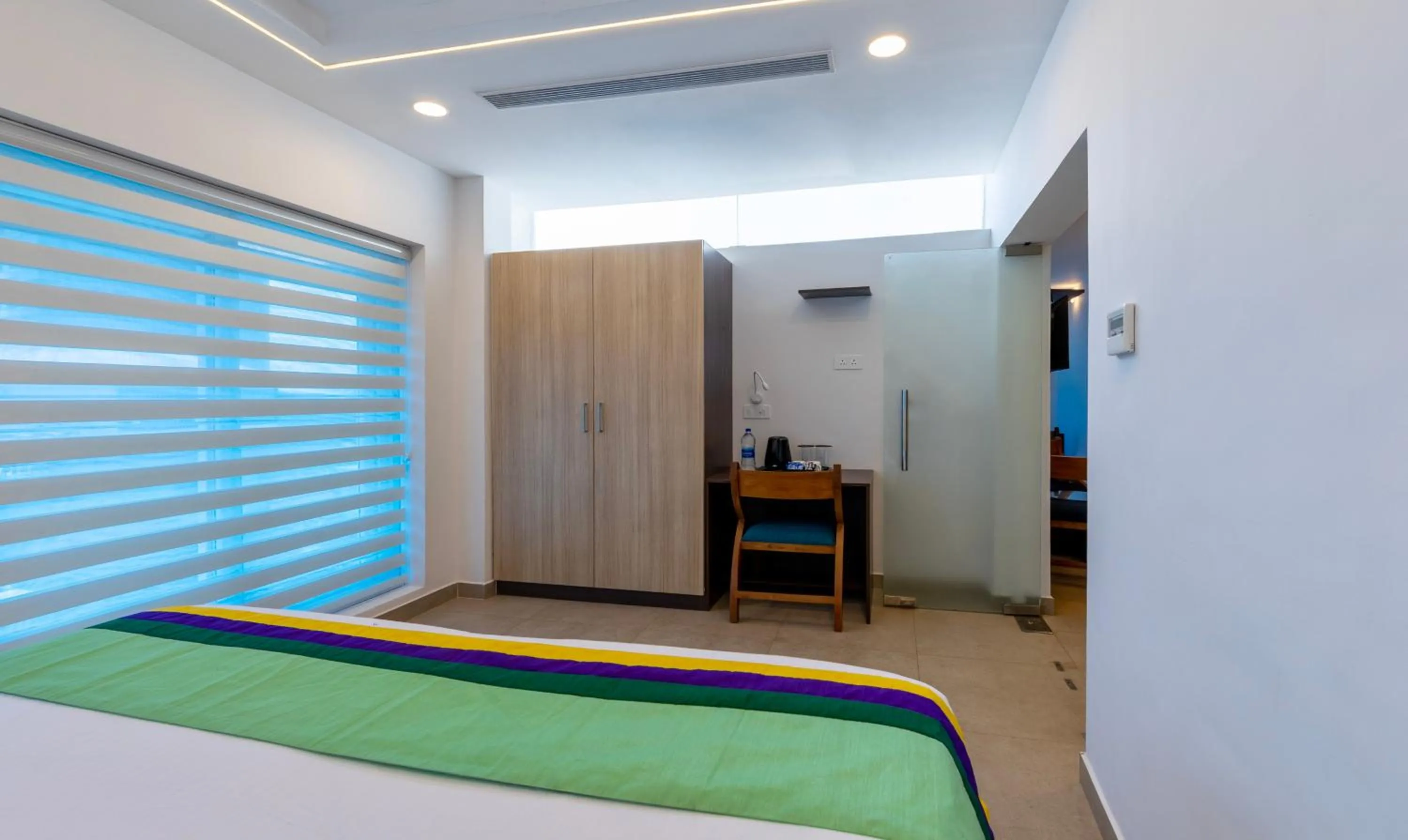 Bed in Treebo vSaffron Regency, Punnamada Lake