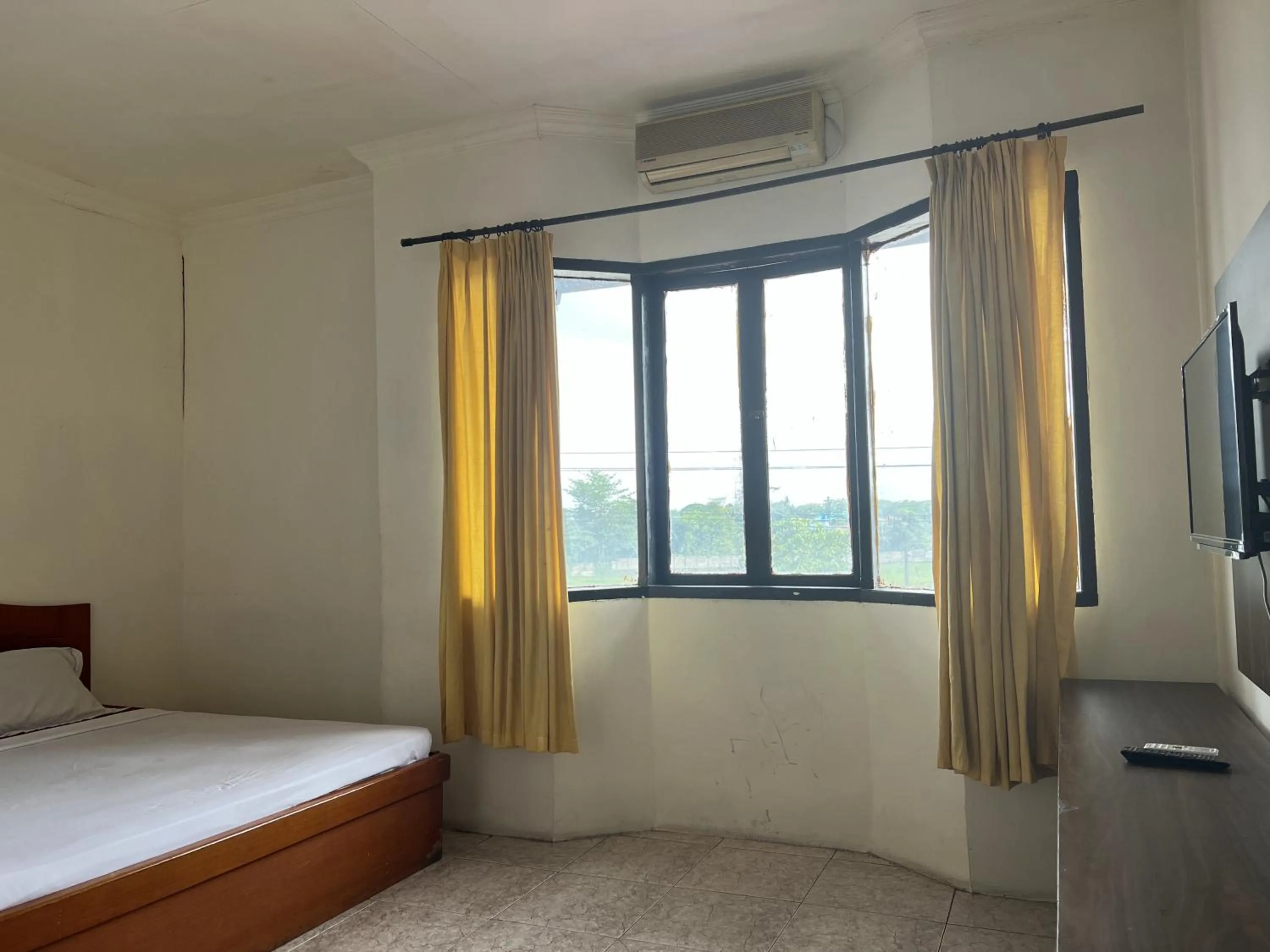 Bedroom, Bed in Hotel O Kost Orange Syariah