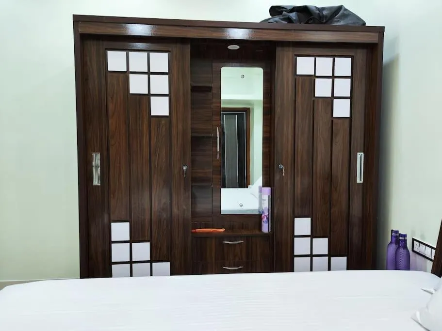 Bed in 1BHK AC Service Apartment 202