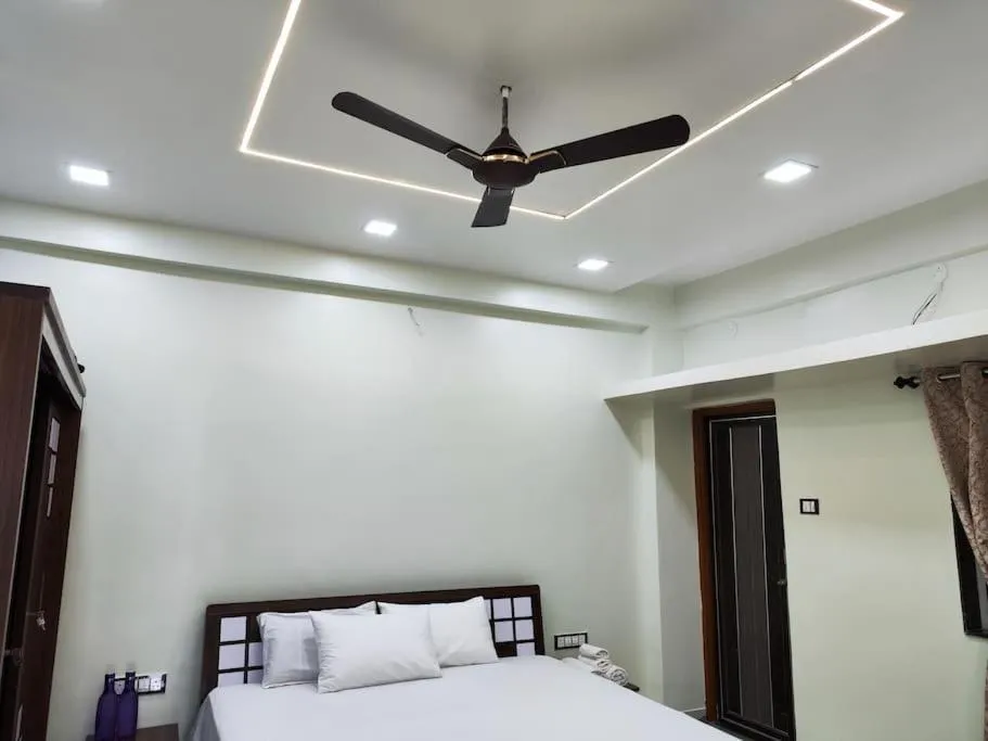 Bed in 1BHK AC Service Apartment 202