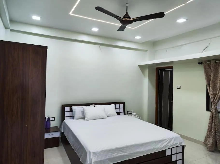 Bed in 1BHK AC Service Apartment 202
