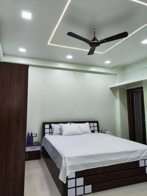 Bed in 1BHK AC Service Apartment 202