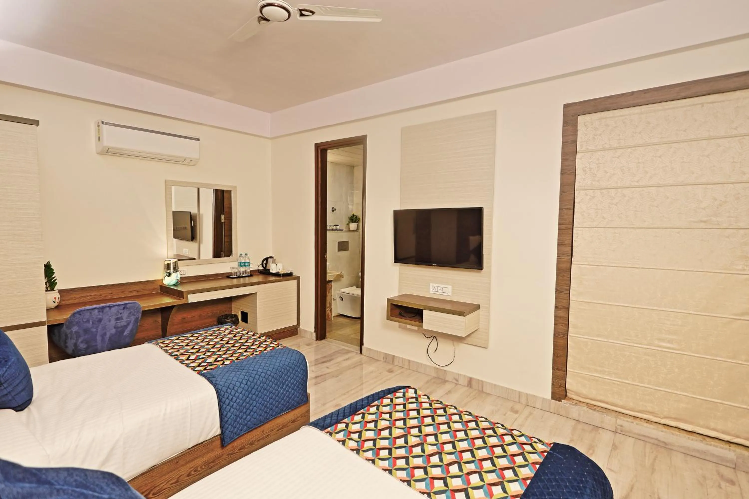 Bed in Hotel Cardinal Oxmo Delhi Airport