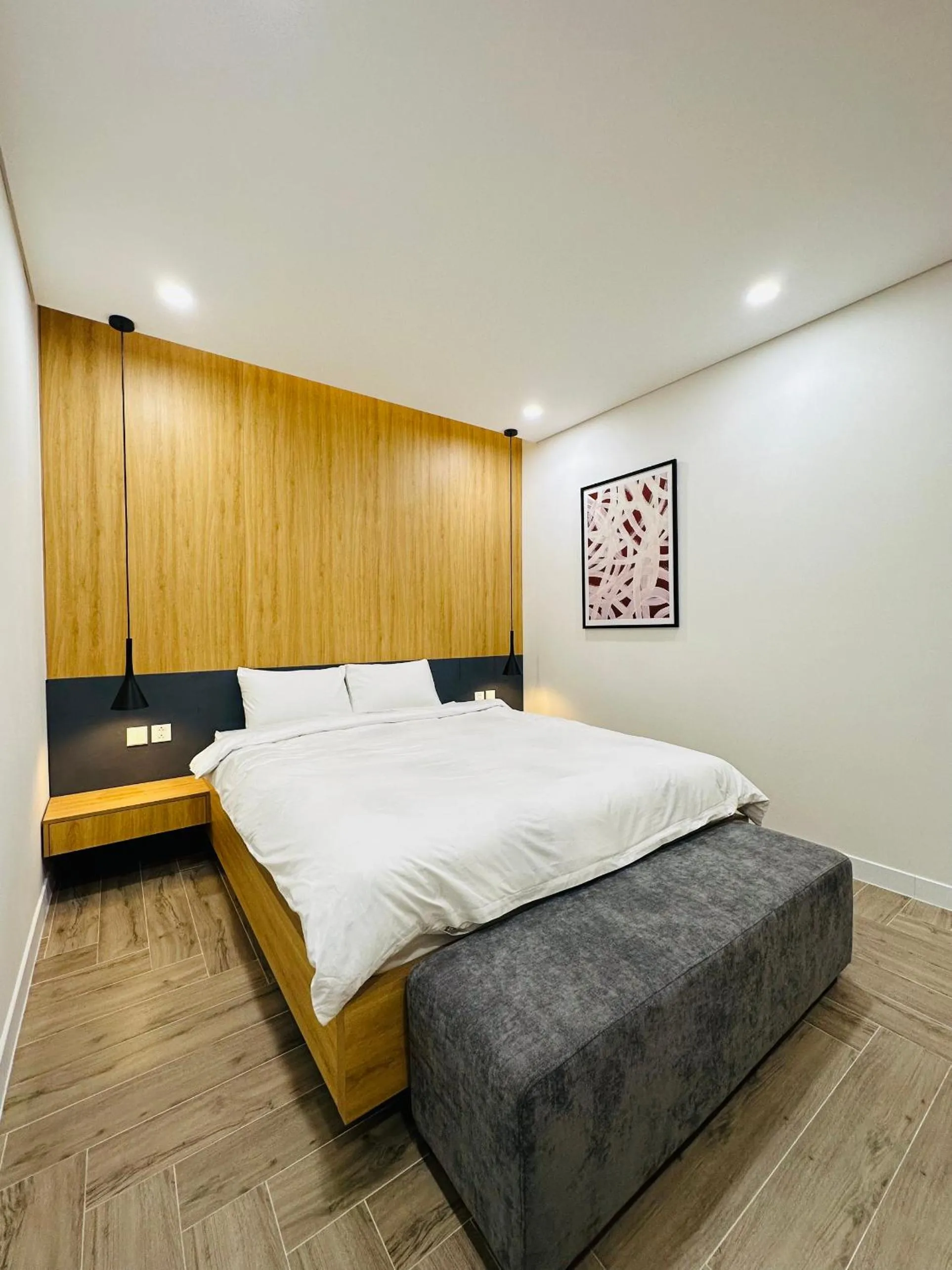 Bed in TSQ STAY Hotel Apartment