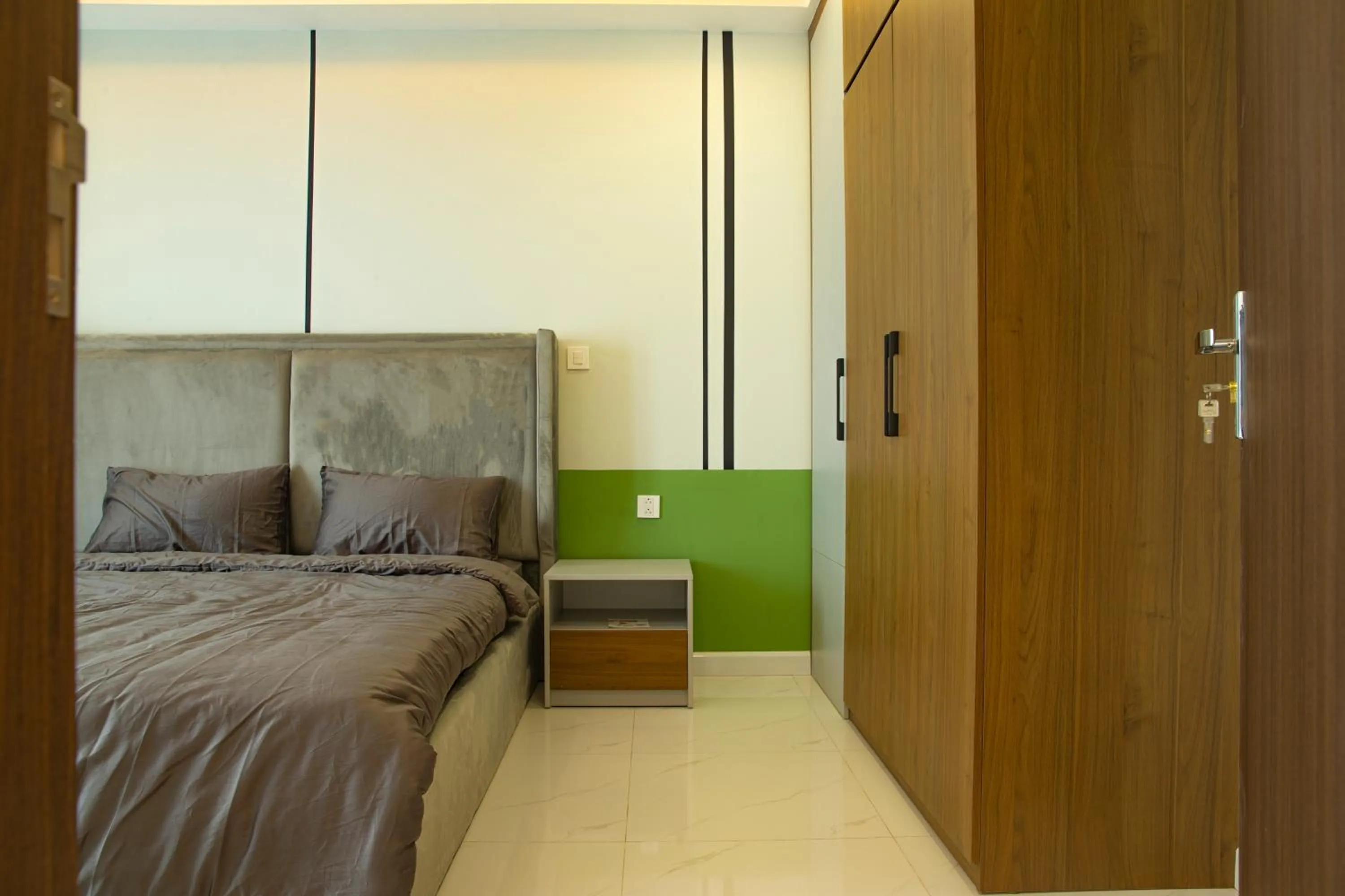 Bed in TSQ STAY Hotel Apartment