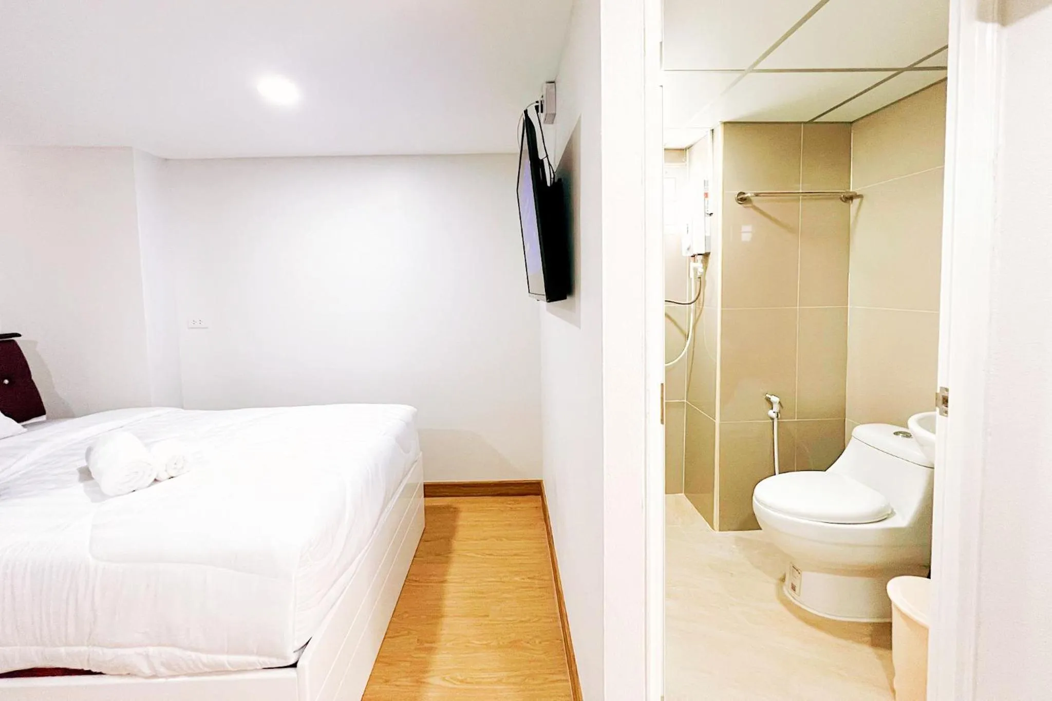 Bed in PT Grand Hotel