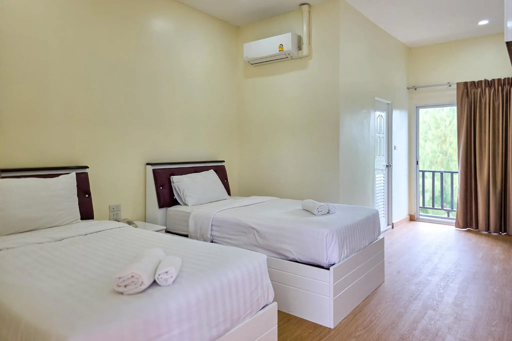 Bed in PT Grand Hotel