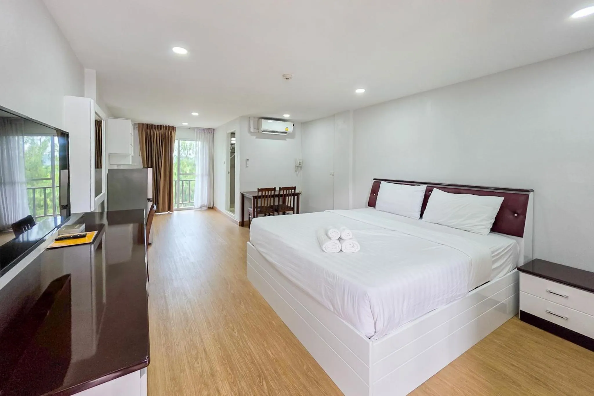 Bed in PT Grand Hotel