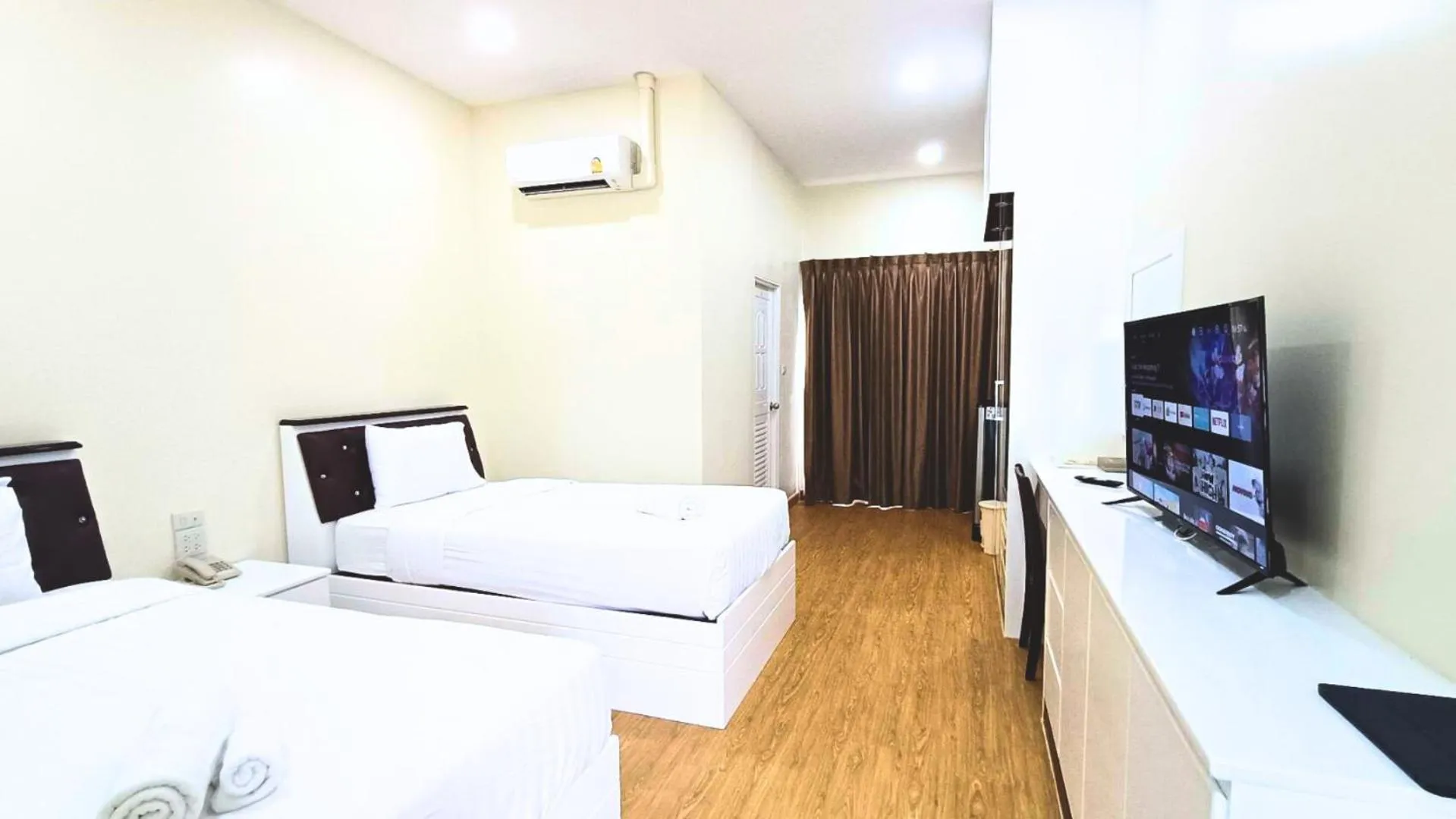 Bed in PT Grand Hotel