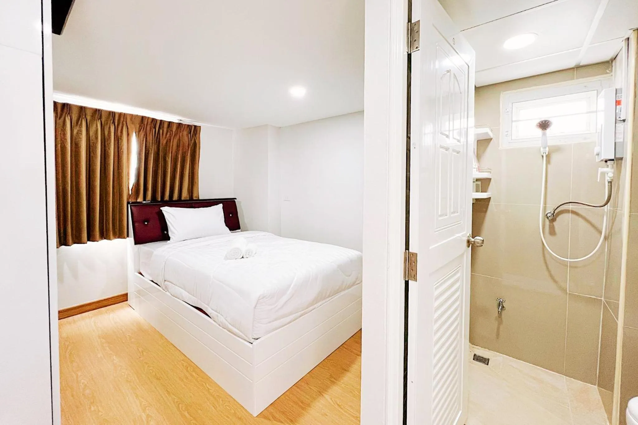 Bed in PT Grand Hotel