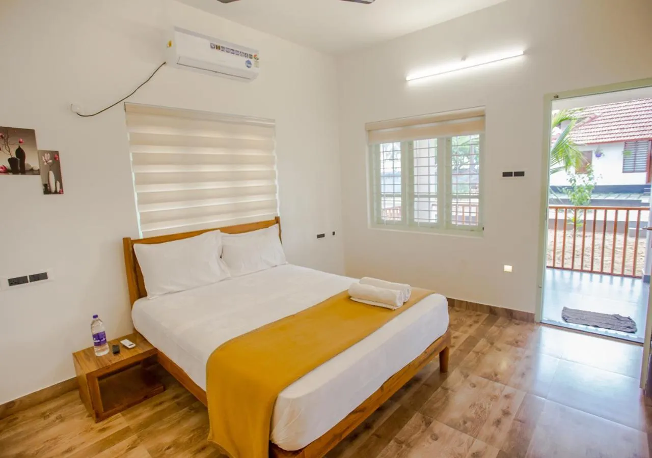 Bed in Ocean View Beach Villa Varkala by VOYE HOMES