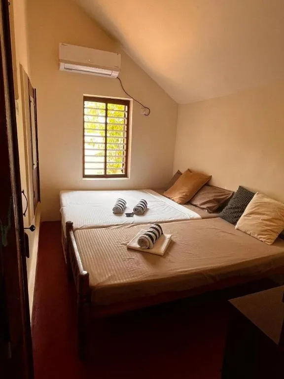 Bed in Ocean View Beach Villa Varkala by VOYE HOMES