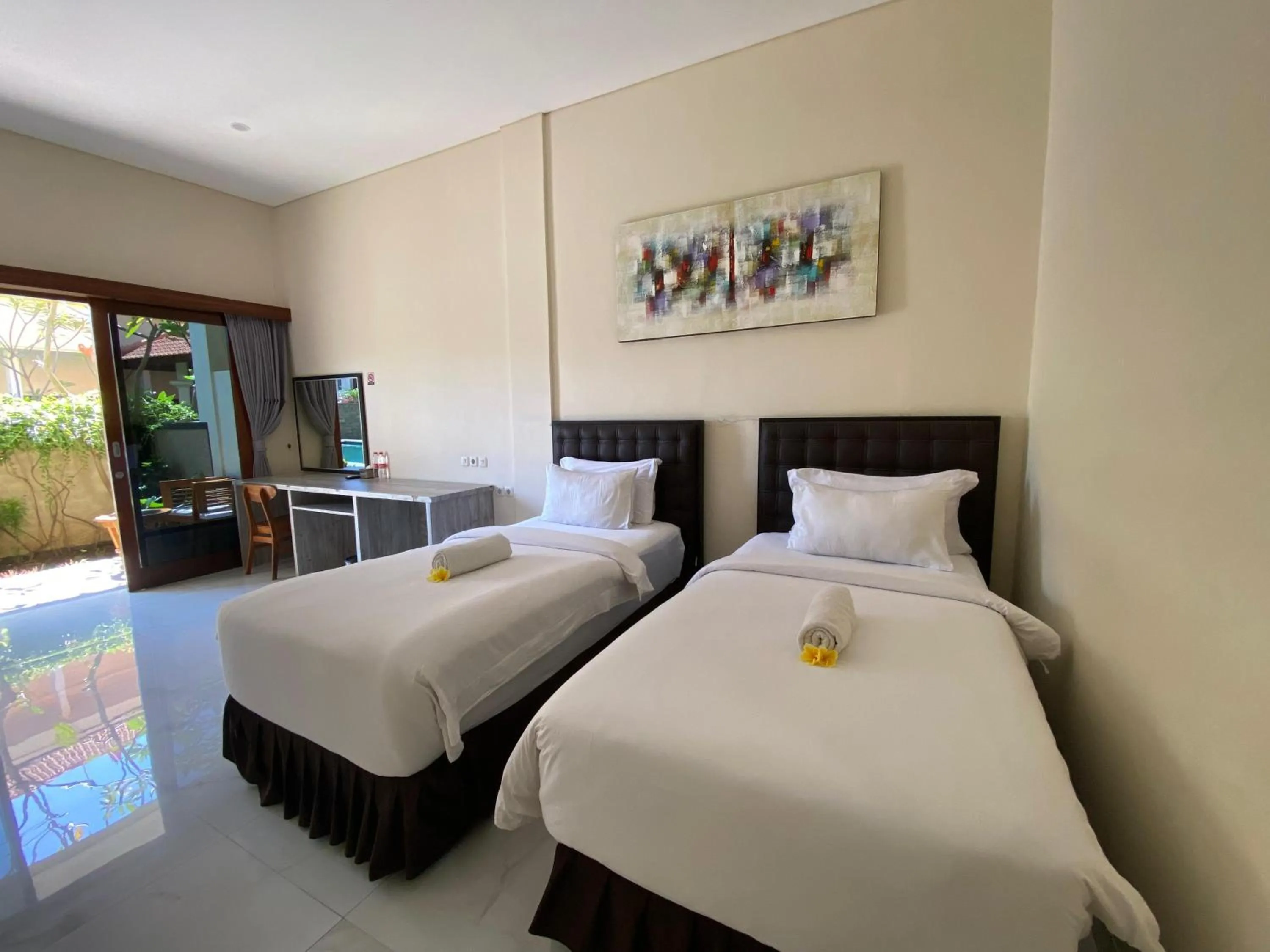 Bed in THE LAVIANA HOTEL