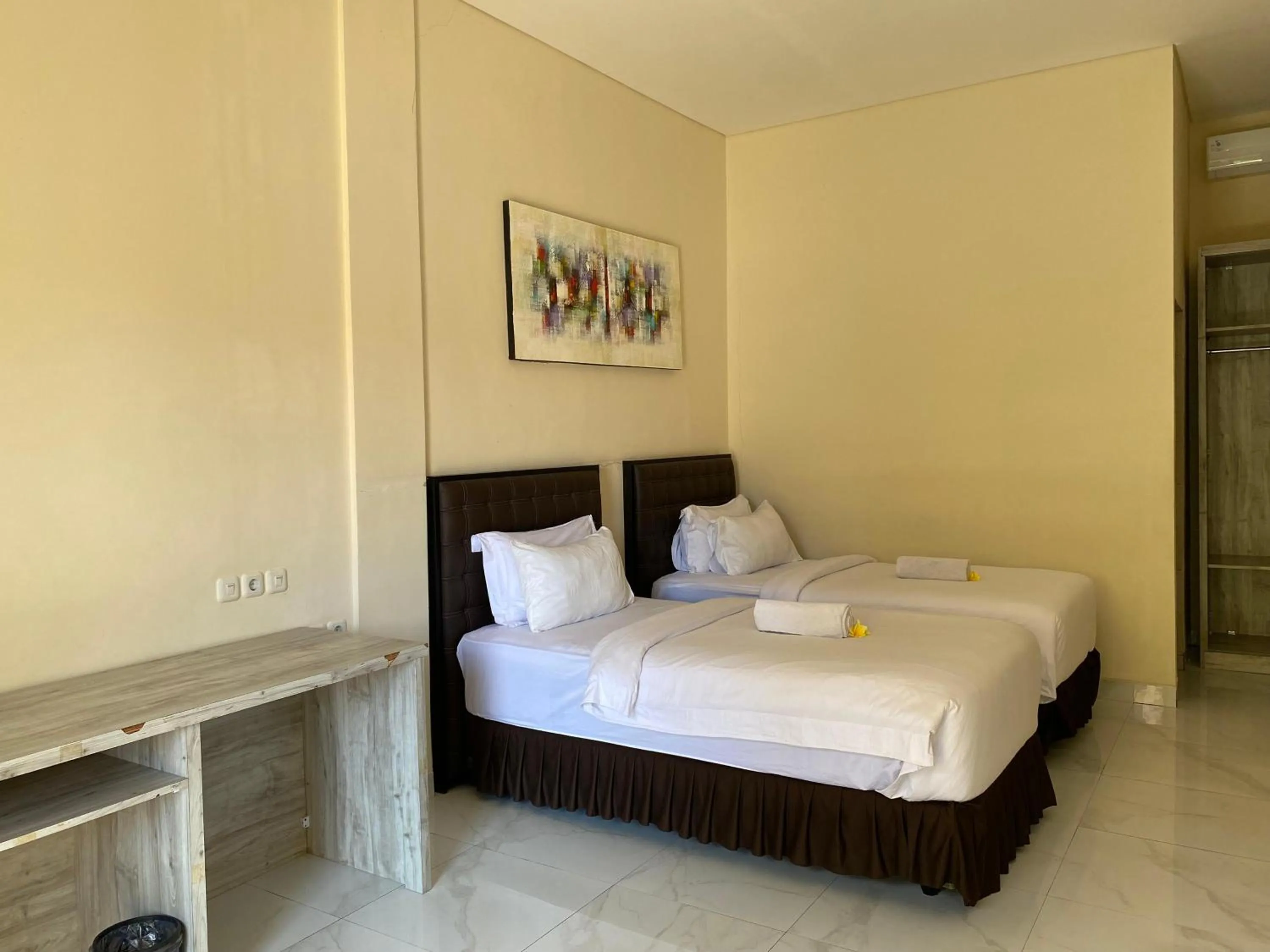 Bed in THE LAVIANA HOTEL