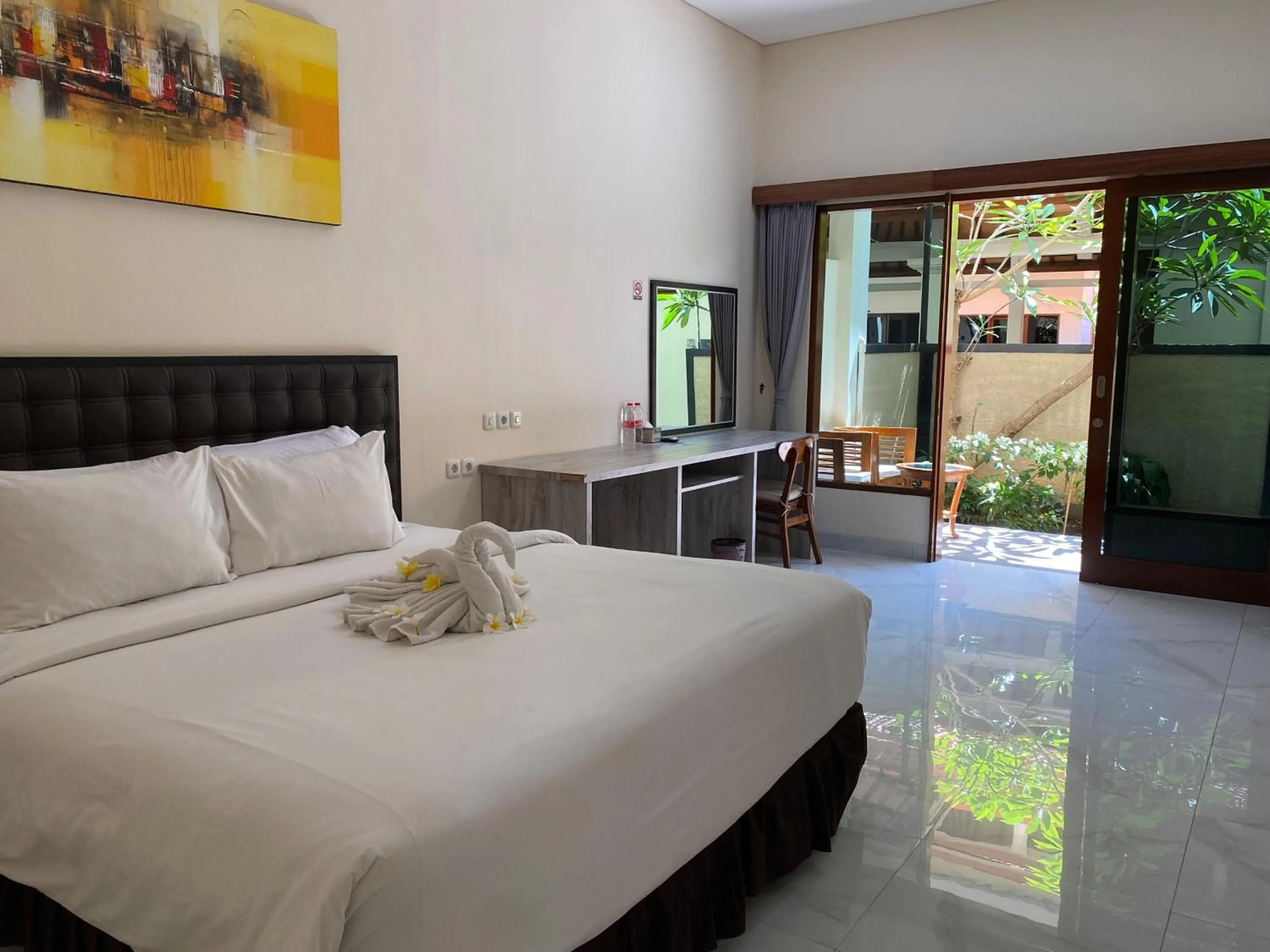 Bed in THE LAVIANA HOTEL