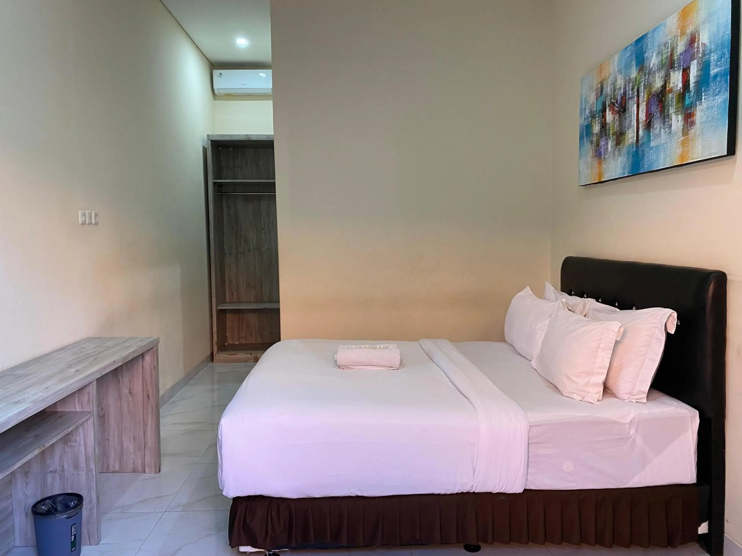 Bed in THE LAVIANA HOTEL