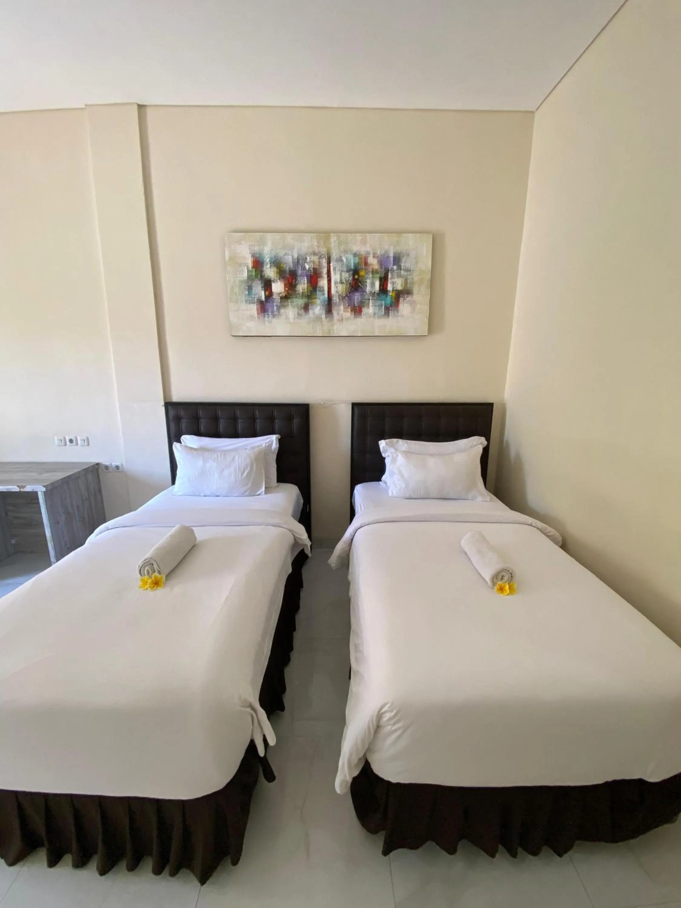 Bed in THE LAVIANA HOTEL