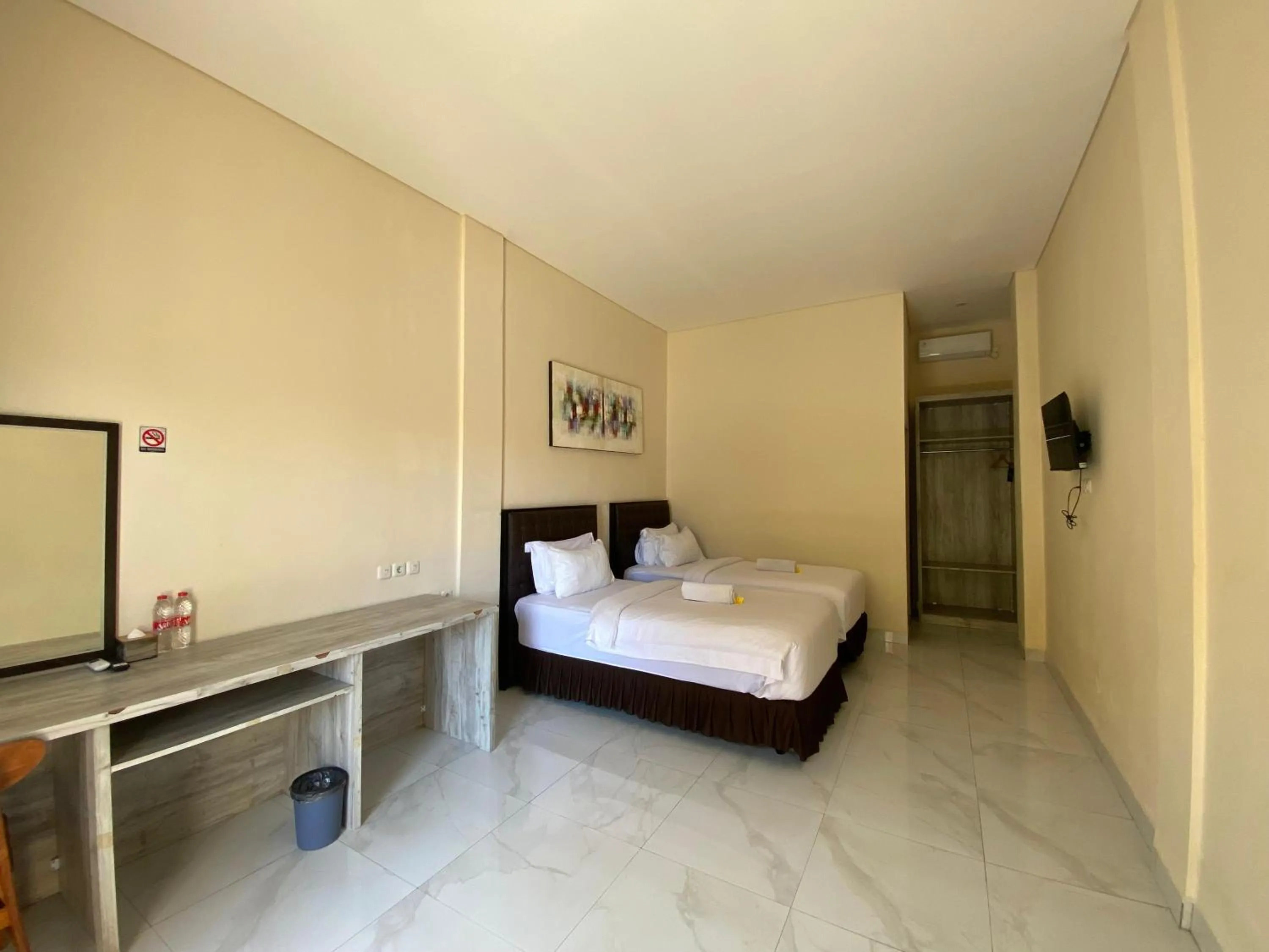 Bed in THE LAVIANA HOTEL