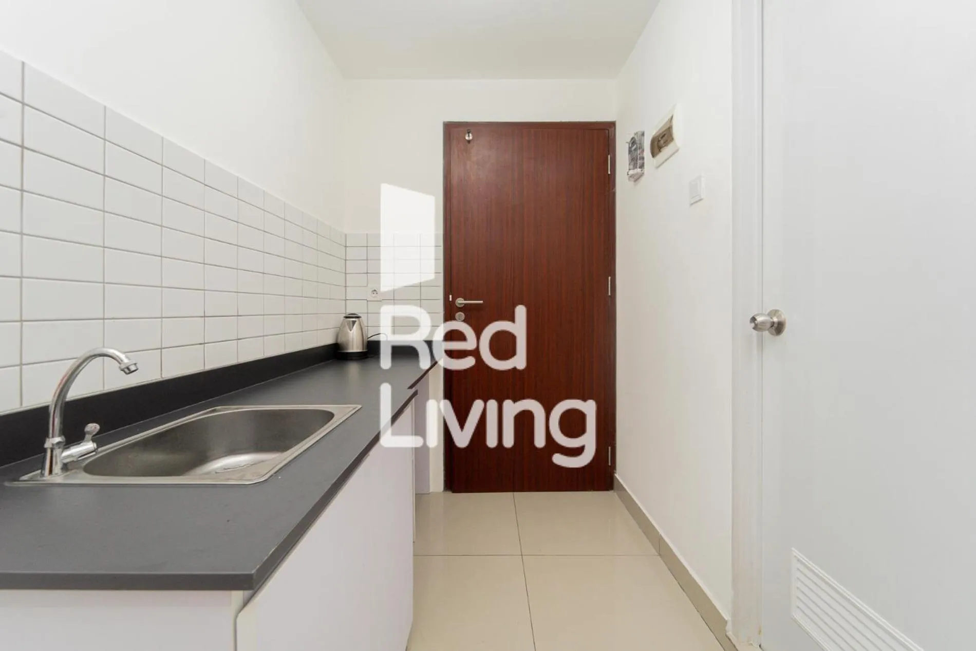 Kitchen or kitchenette in RedLiving Apartemen Sayana - Sentra Jaya