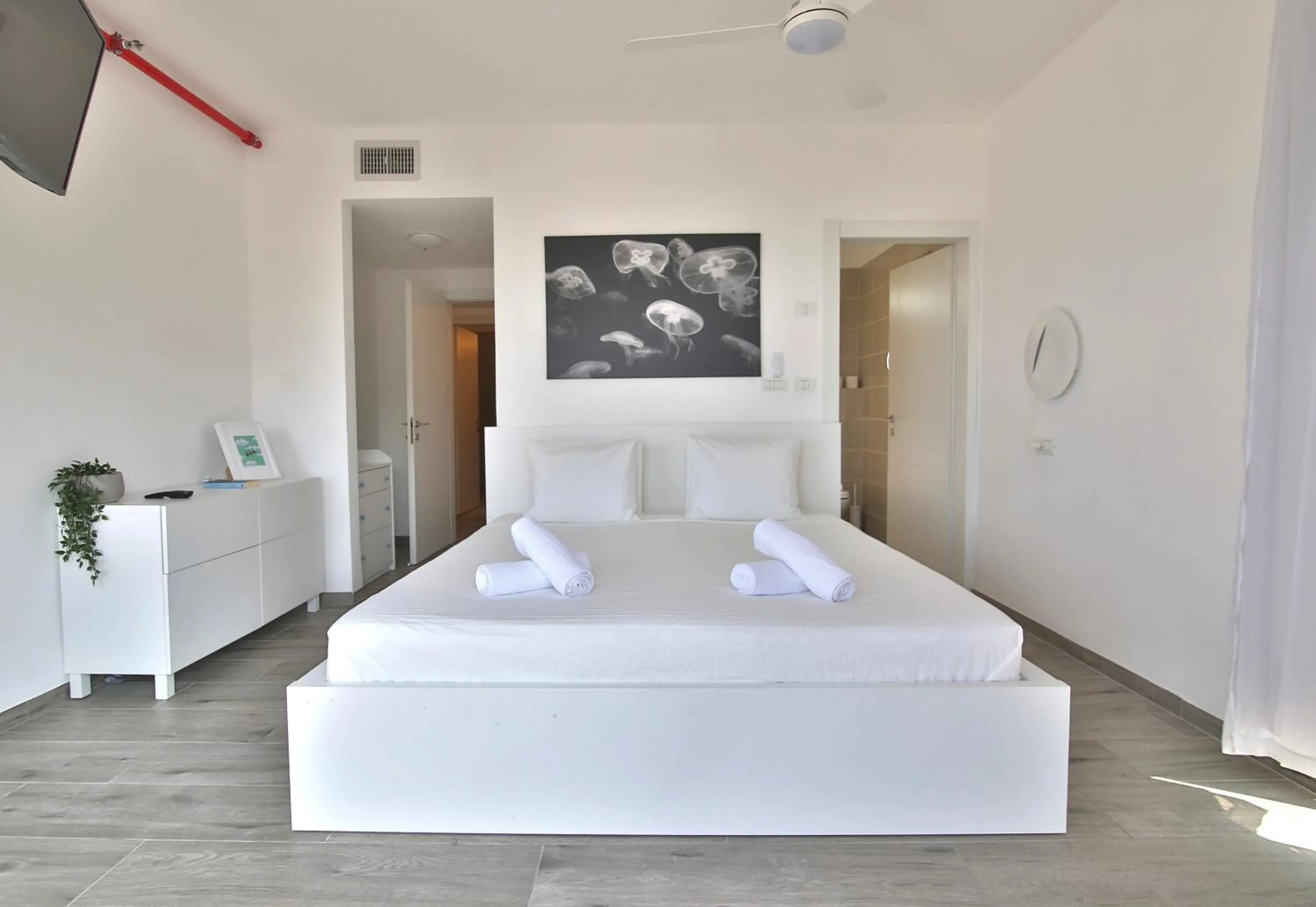 Bed in Bat-Galim Beach Apartment