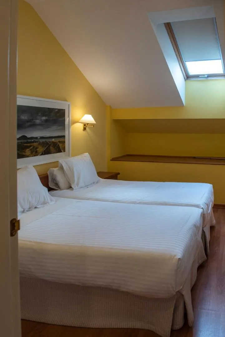 Photo of the whole room, Bed in Hotel Faro de San Vicente