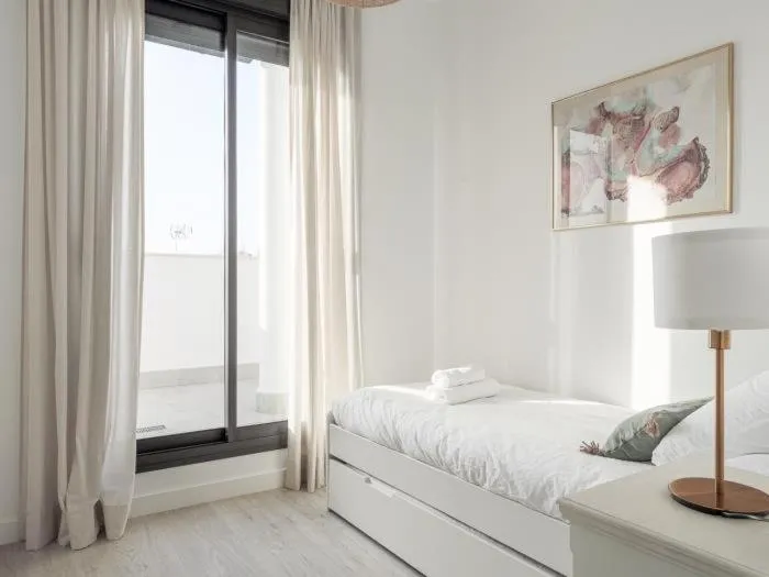 Bedroom, Bed in Uxama Sevilla Luxury Penthouse en Triana - Terraza y parking privados - piscina