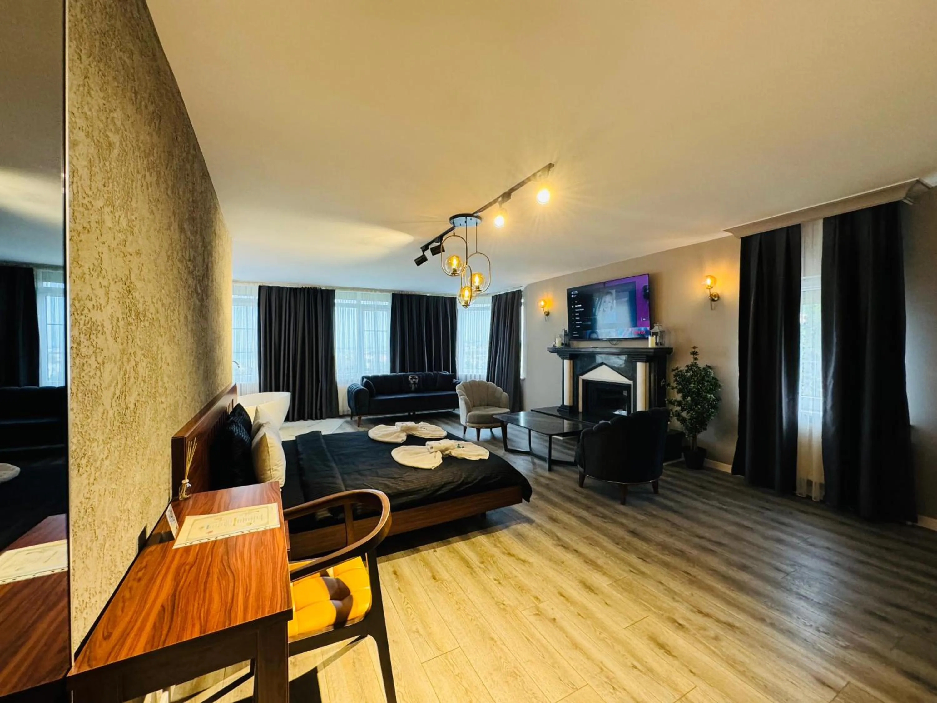 Communal lounge/ TV room, Bed in Istanbul Airport Treekos Suite Hotel