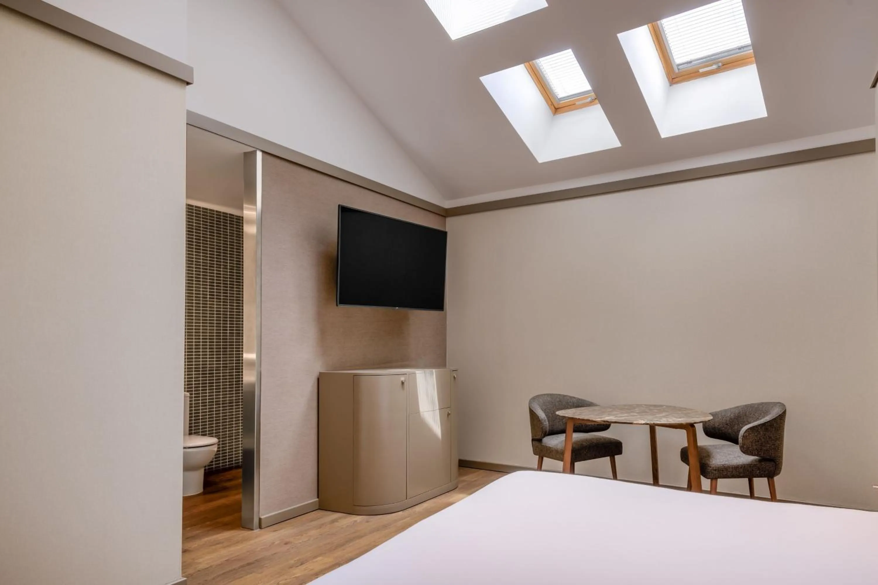 Photo of the whole room, Bed in AC Hotel Recoletos by Marriott