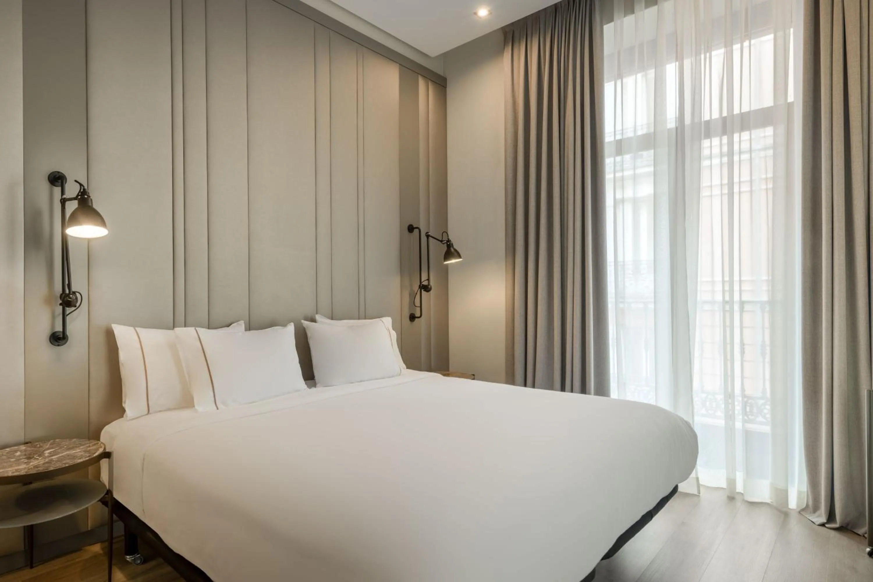 Photo of the whole room, Bed in AC Hotel Recoletos by Marriott