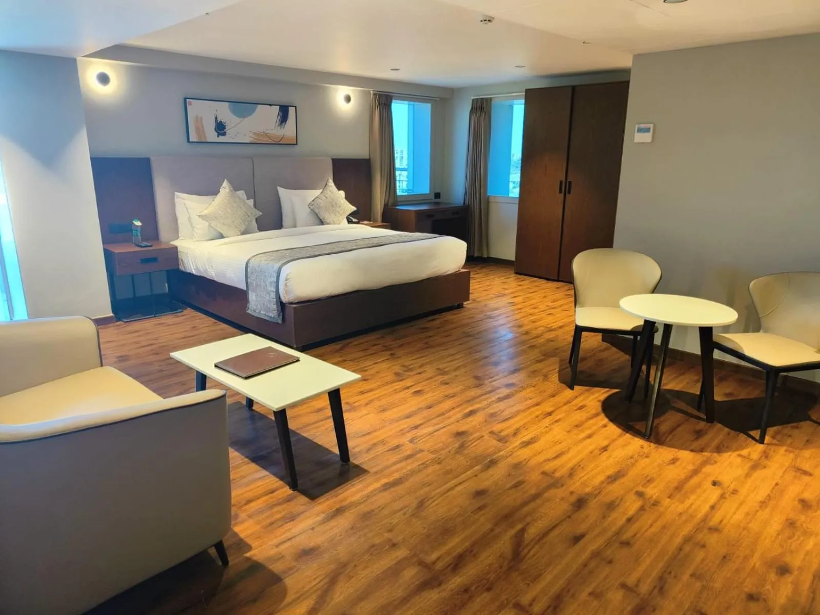 Living room, Bed in Ramee International Surat