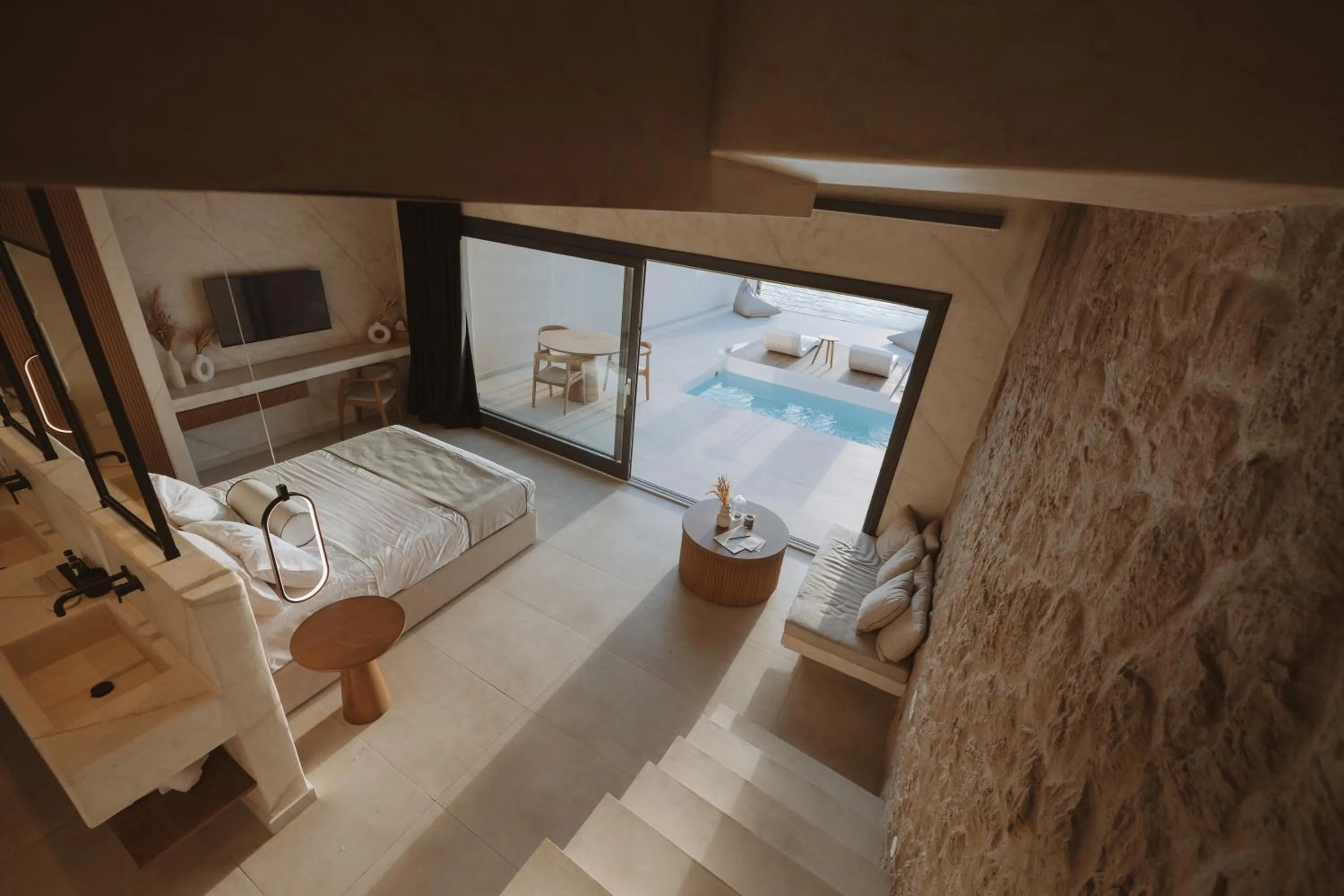 Communal lounge/ TV room in Pnoe Luxury Suites