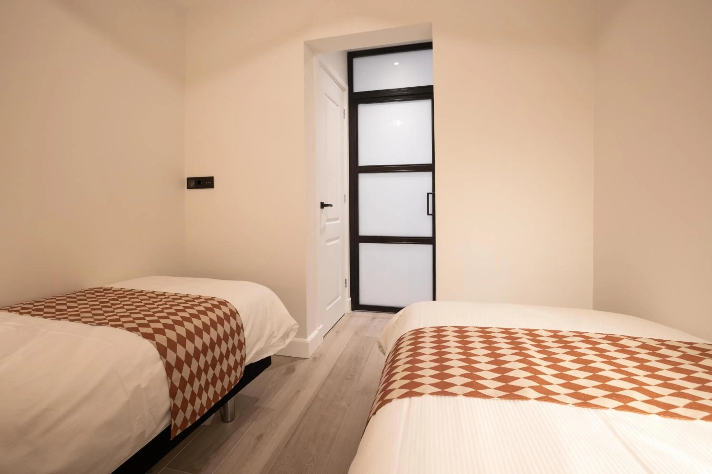 Bed in Modern two bedroom apartment close to the beach
