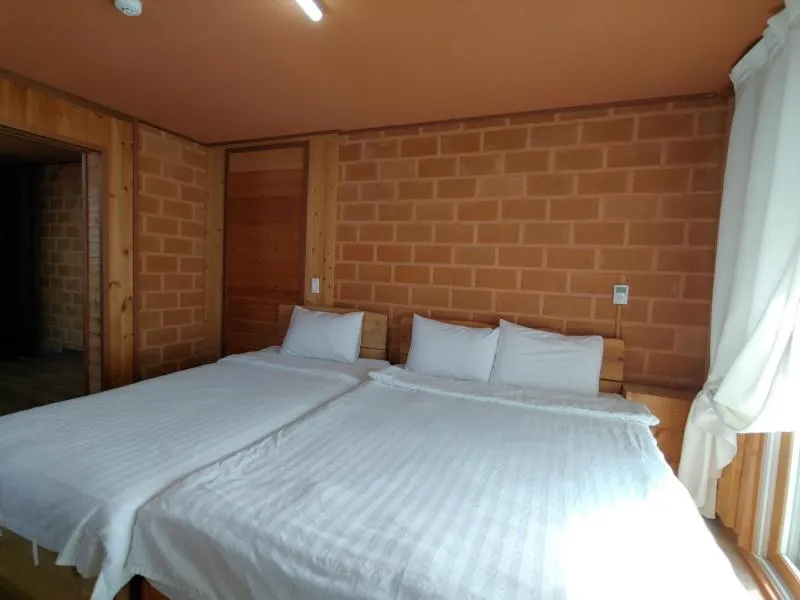 Bed in Jeju Hanibaram Pension