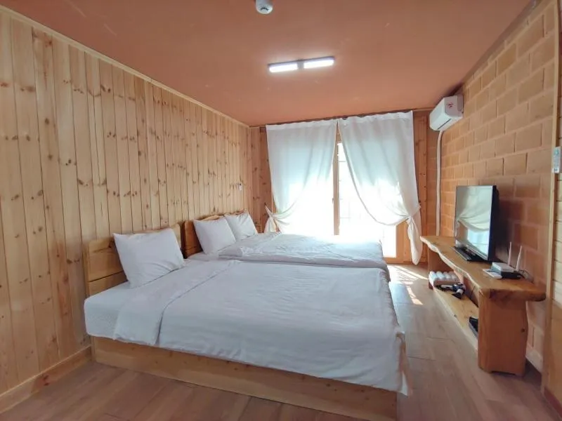 Bed in Jeju Hanibaram Pension