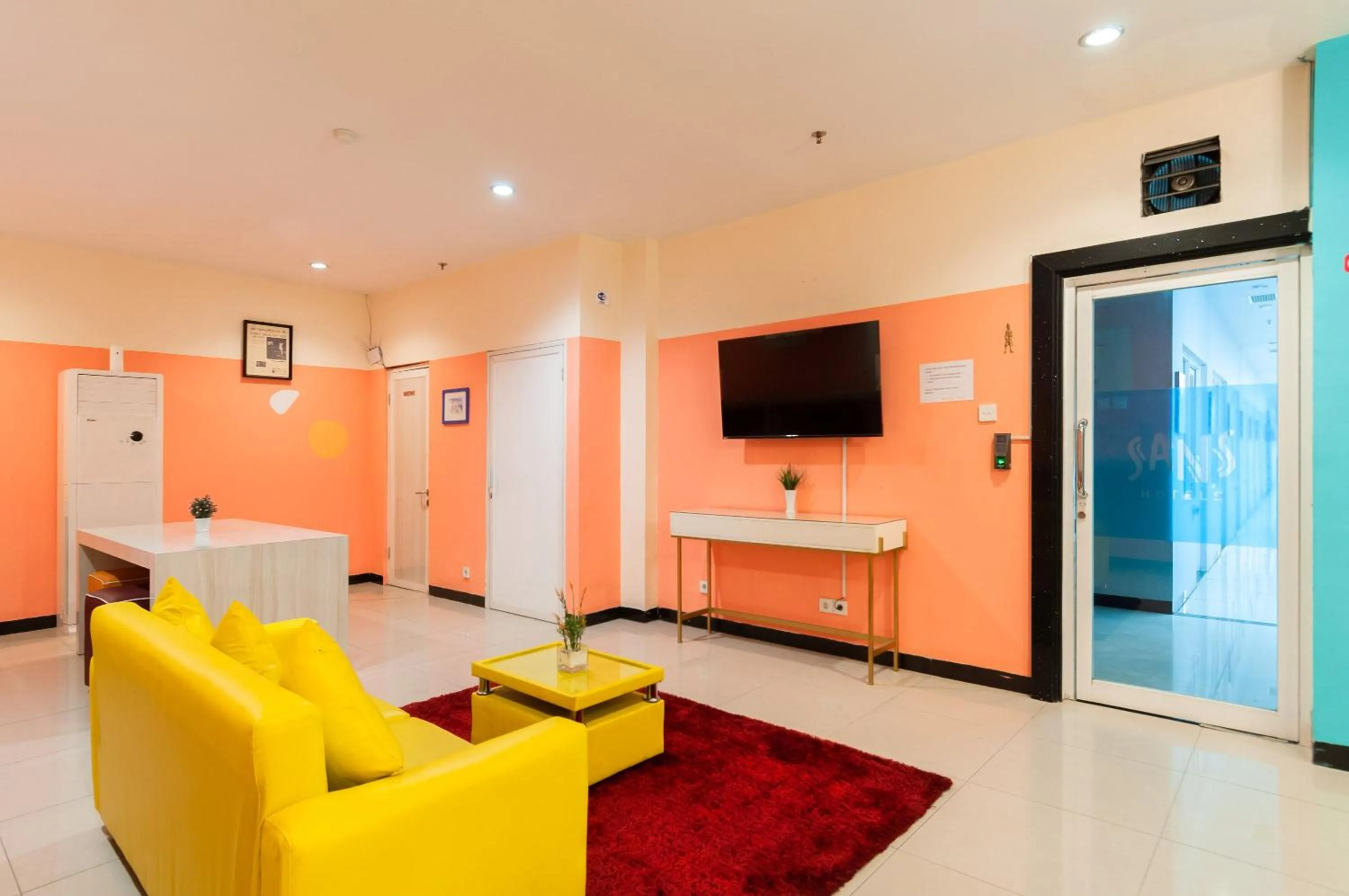 Living room in Sans Hotel Finest Medan