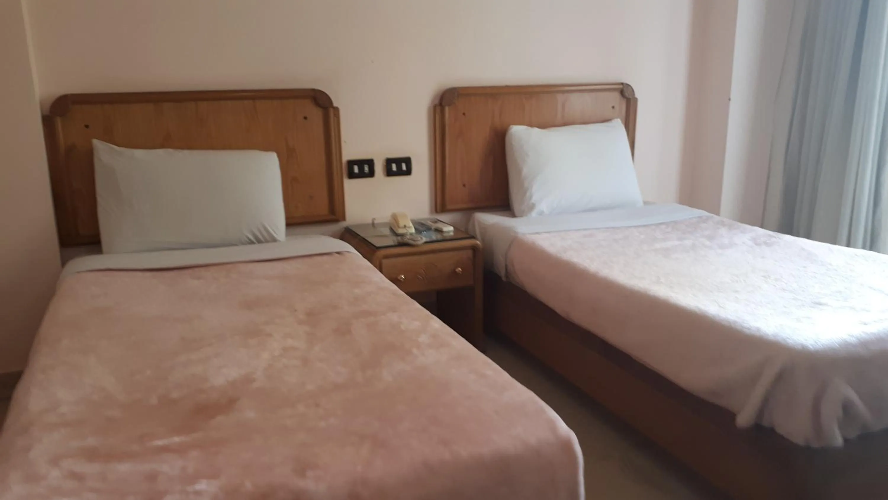 Bed in New Pola Hotel