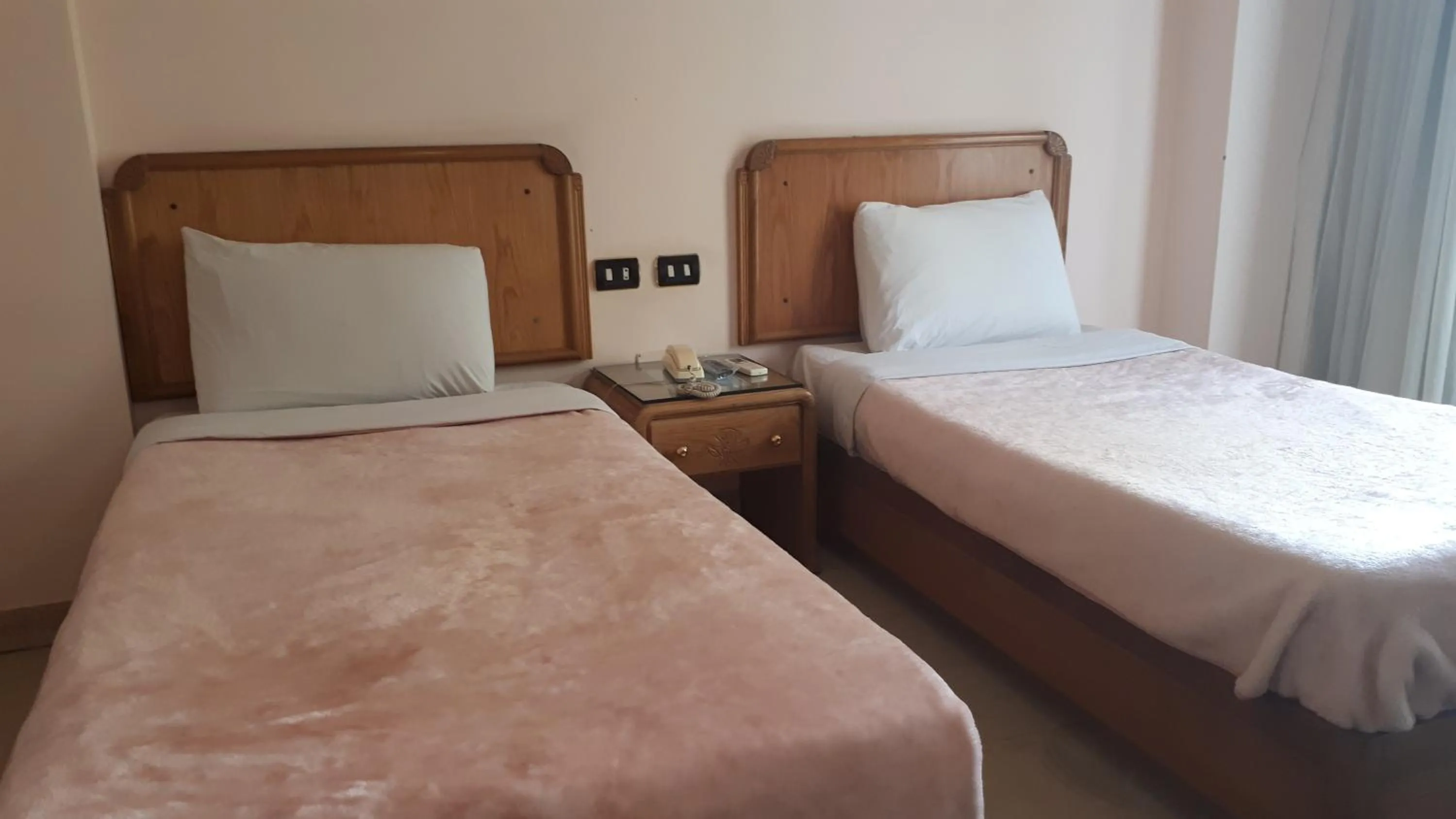 Bed in New Pola Hotel