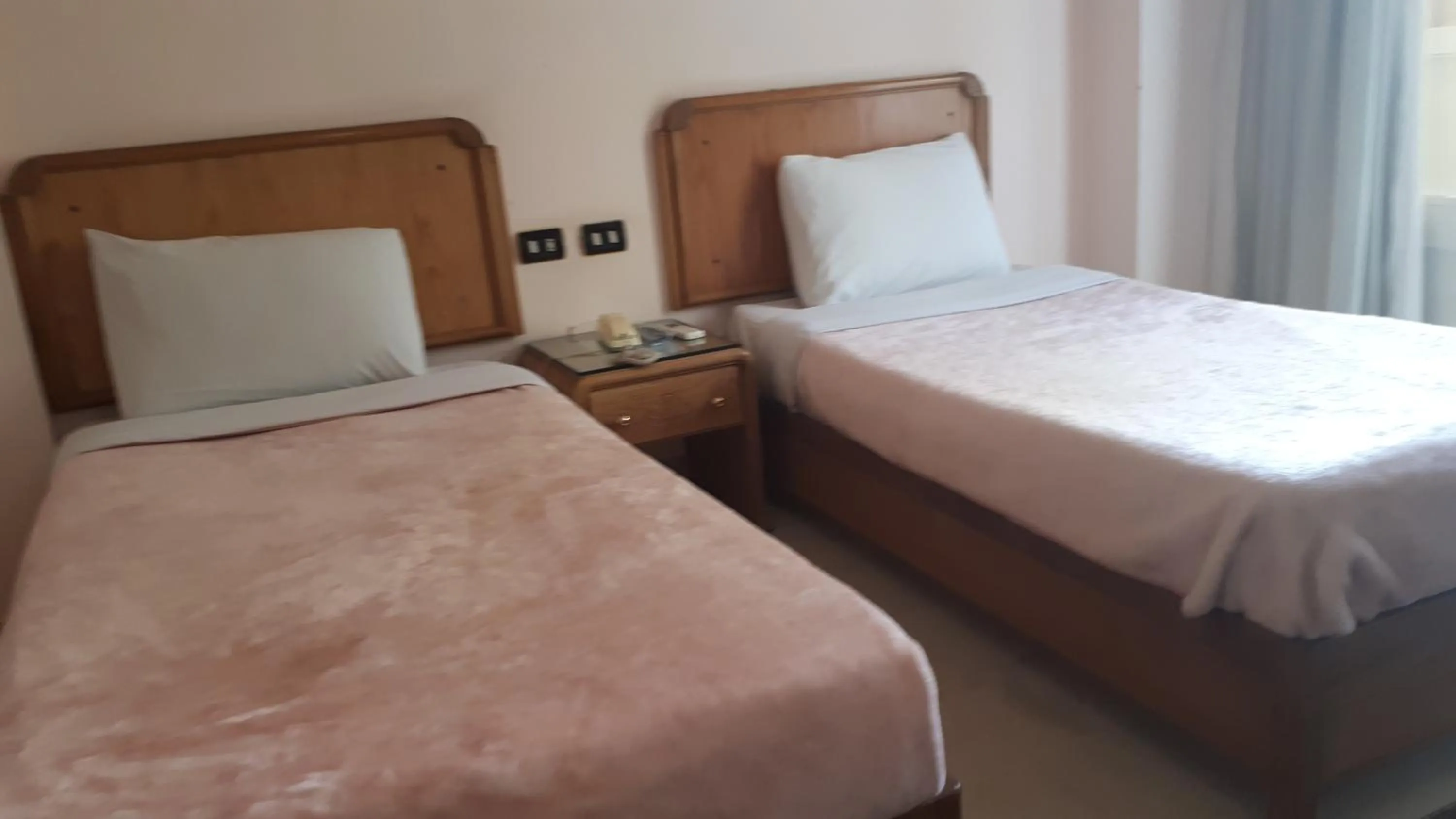 Bed in New Pola Hotel